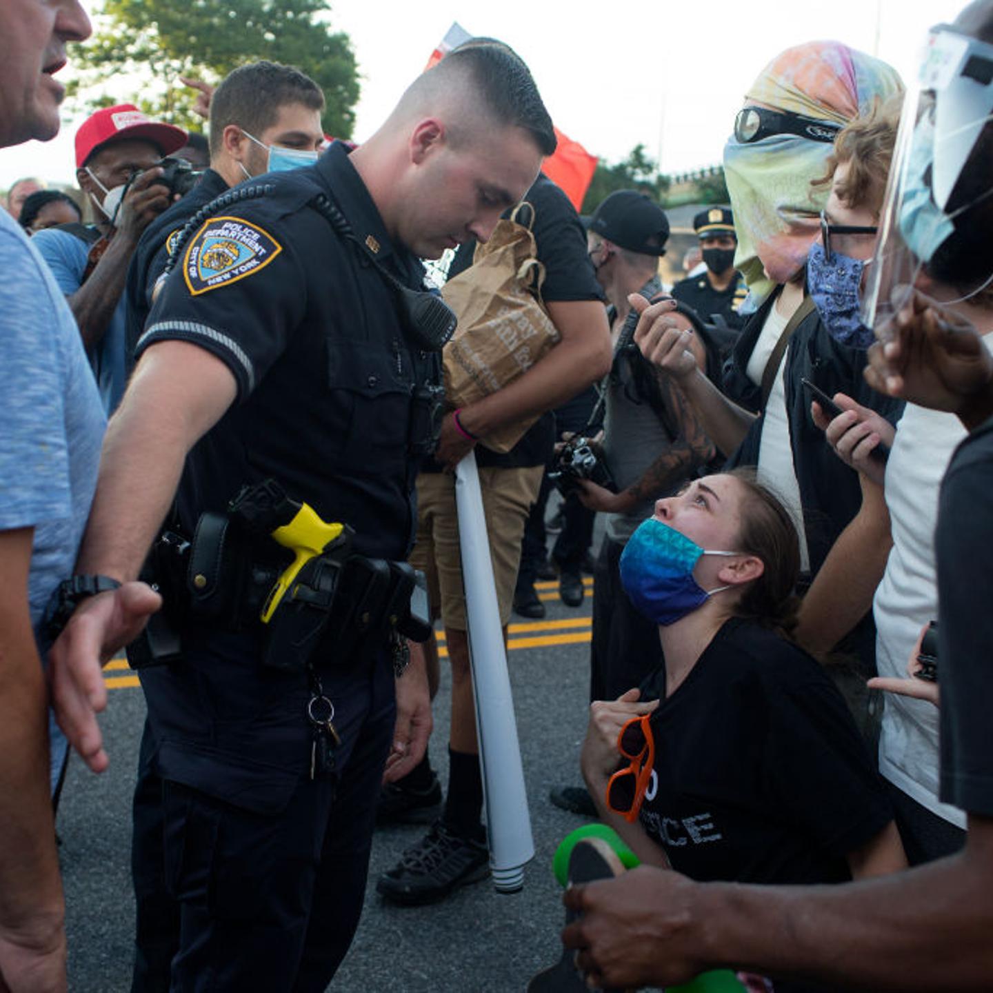 Blue Lives Matter and Black Lives Matters marchers confront each other in Brooklyn