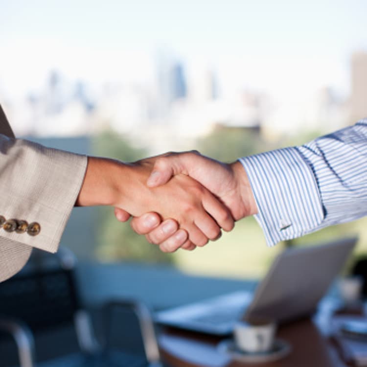 people-shaking-hands-cafe