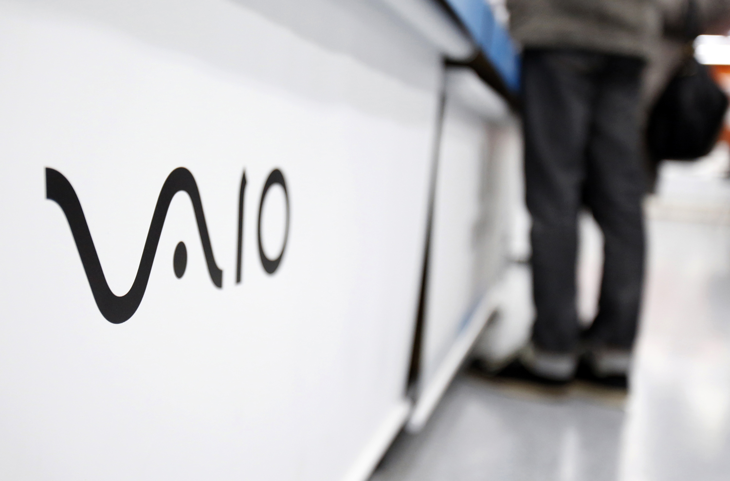 A logo of Sony Corp's Vaio is seen as a shopper looks at products at an electronics retail store in Tokyo
