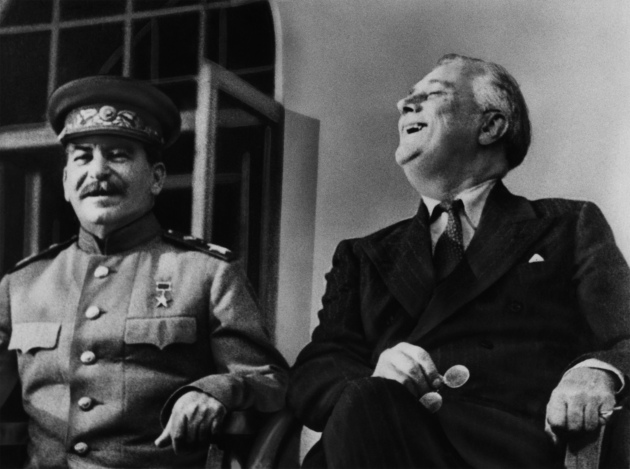 Soviet Premier Josef Stalin and US President Franklin Delano Roosevelt appear on the porch of the Russian embassy in Tehran, Iran in 1943.