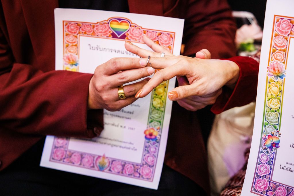 LGBTQ+ couples take part in a symbolic mass wedding ceremony on Valentine's Day at Siam Center on Feb. 14, 2024 in Bangkok, Thailand.