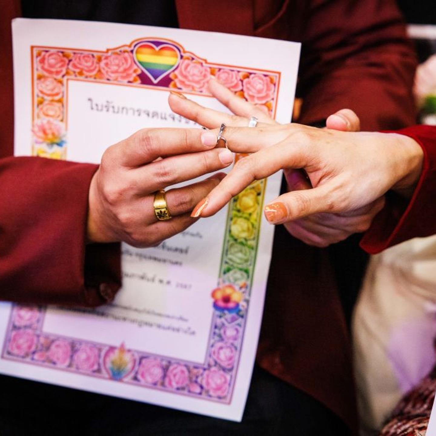 LGBTQ+ couples take part in a symbolic mass wedding ceremony on Valentine's Day at Siam Center on Feb. 14, 2024 in Bangkok, Thailand.