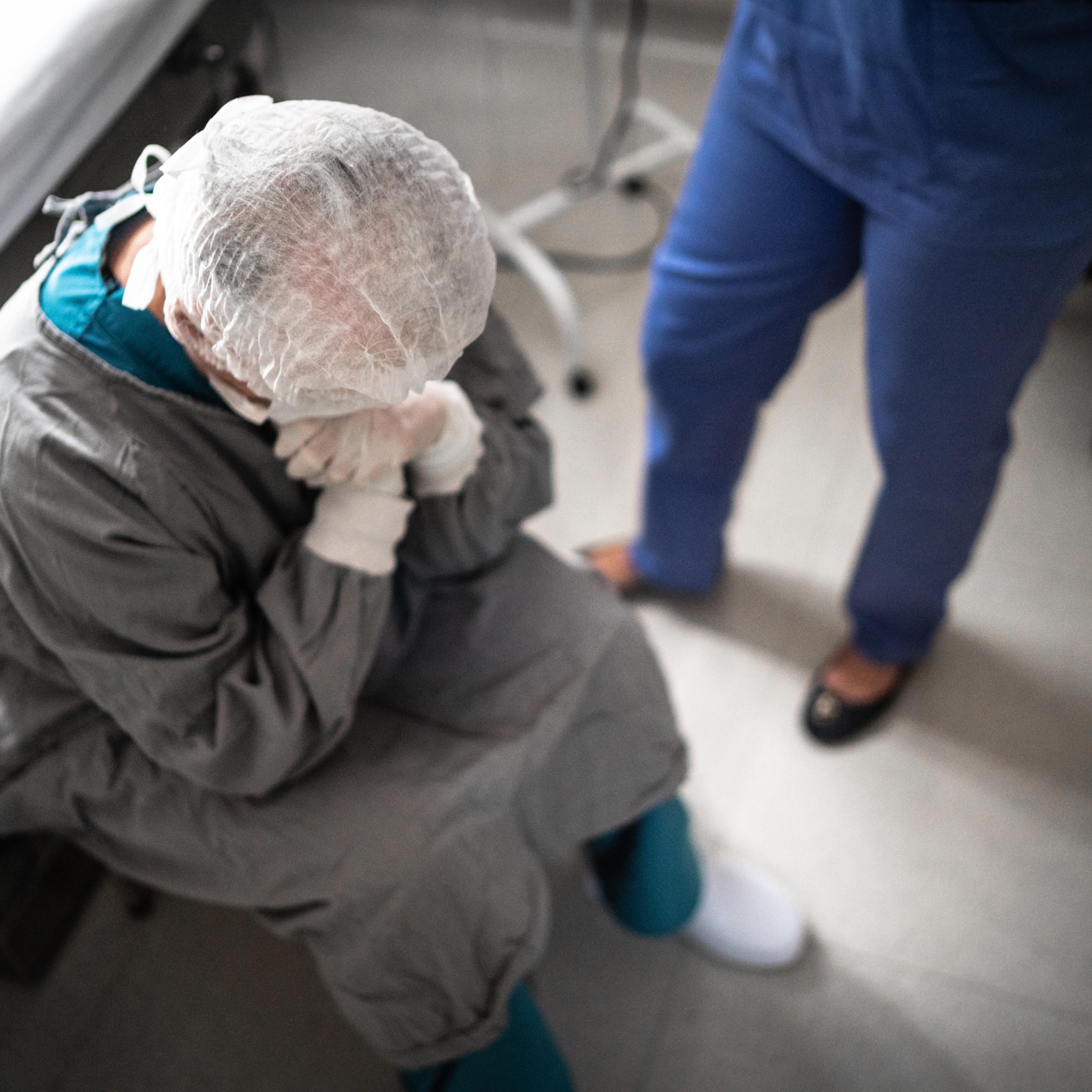 Worried healthcare worker at operating room in hospital