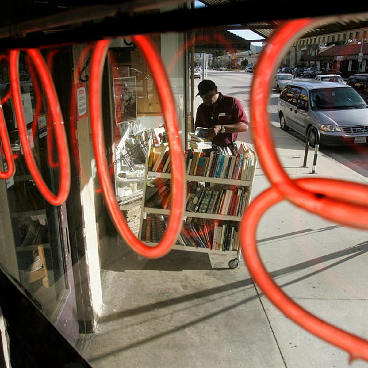 John Thompson of Van Nuys browses through sale books at Dutton's Bookstore in North Hollywood. Dutt