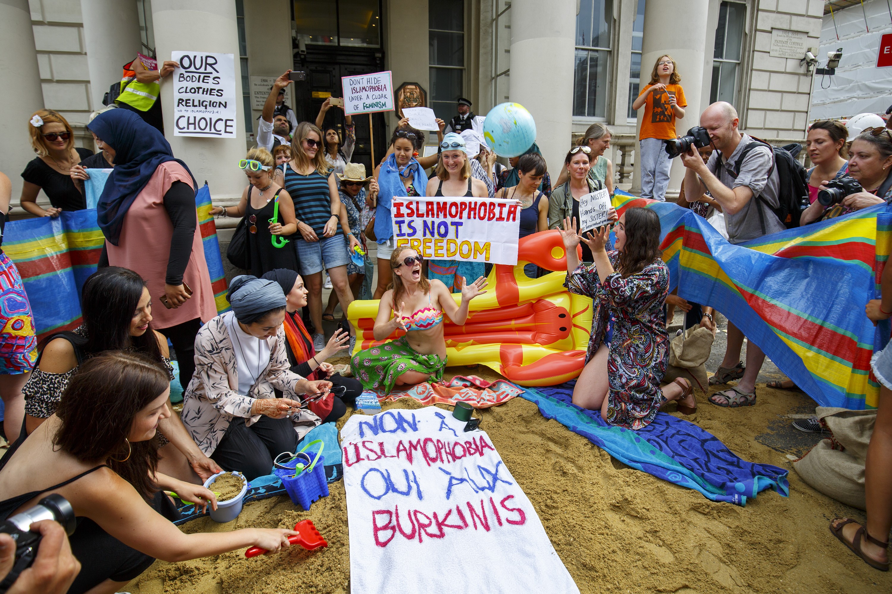 Protesters stage a demonstration named "Wear What You Want" outside the French Embassy in London.
