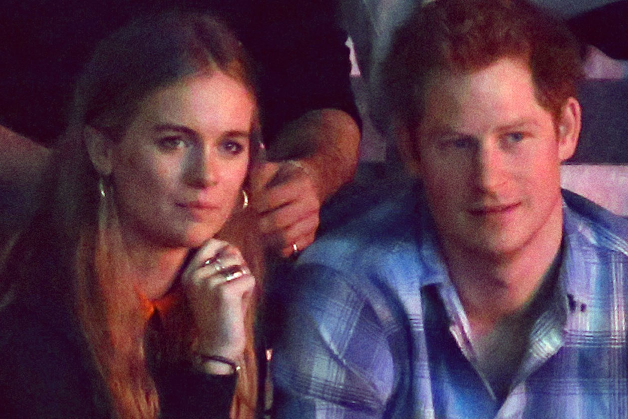 Britain's Prince Harry and Cressida Bonas watch the WE Day UK event at Wembley Arena in London