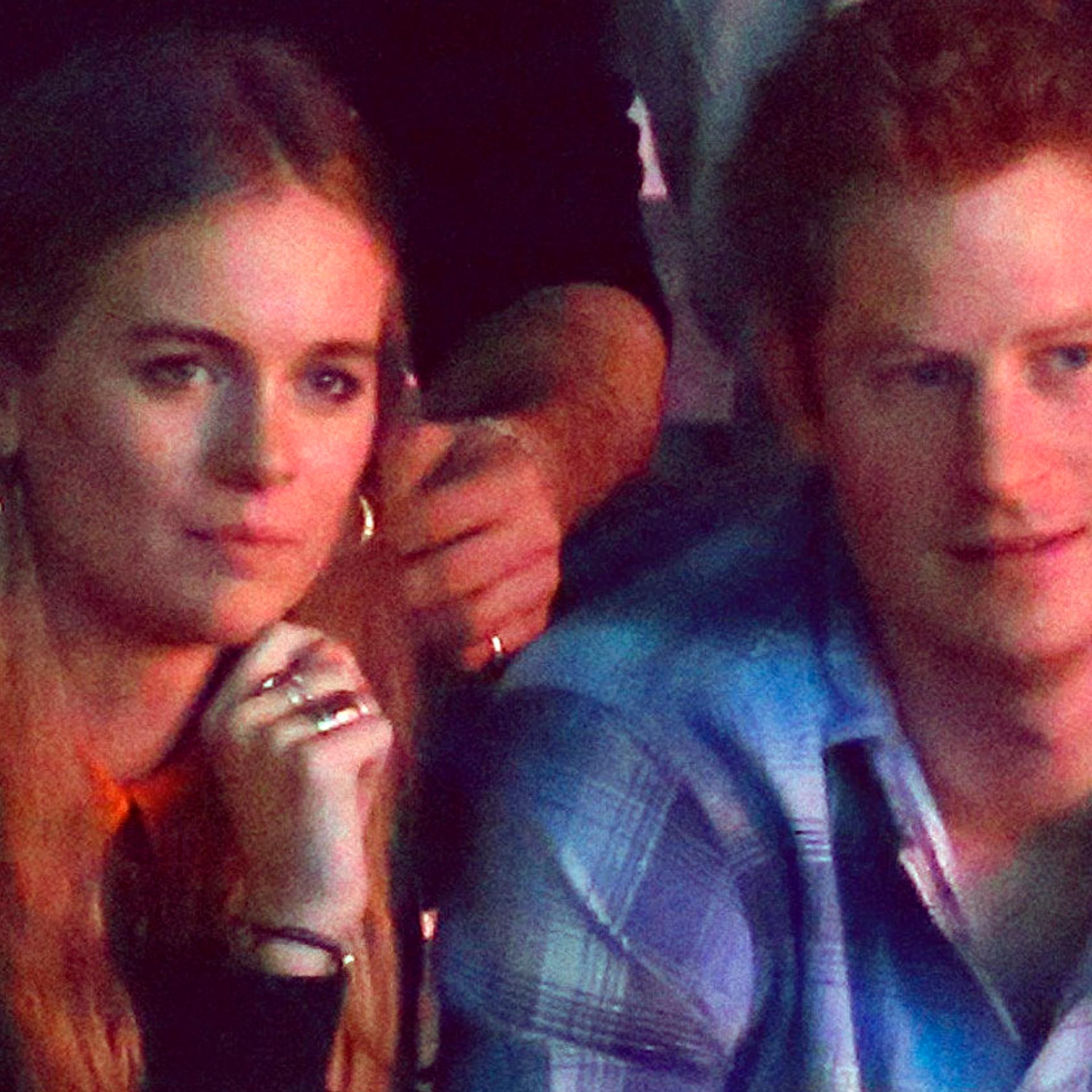 Britain's Prince Harry and Cressida Bonas watch the WE Day UK event at Wembley Arena in London