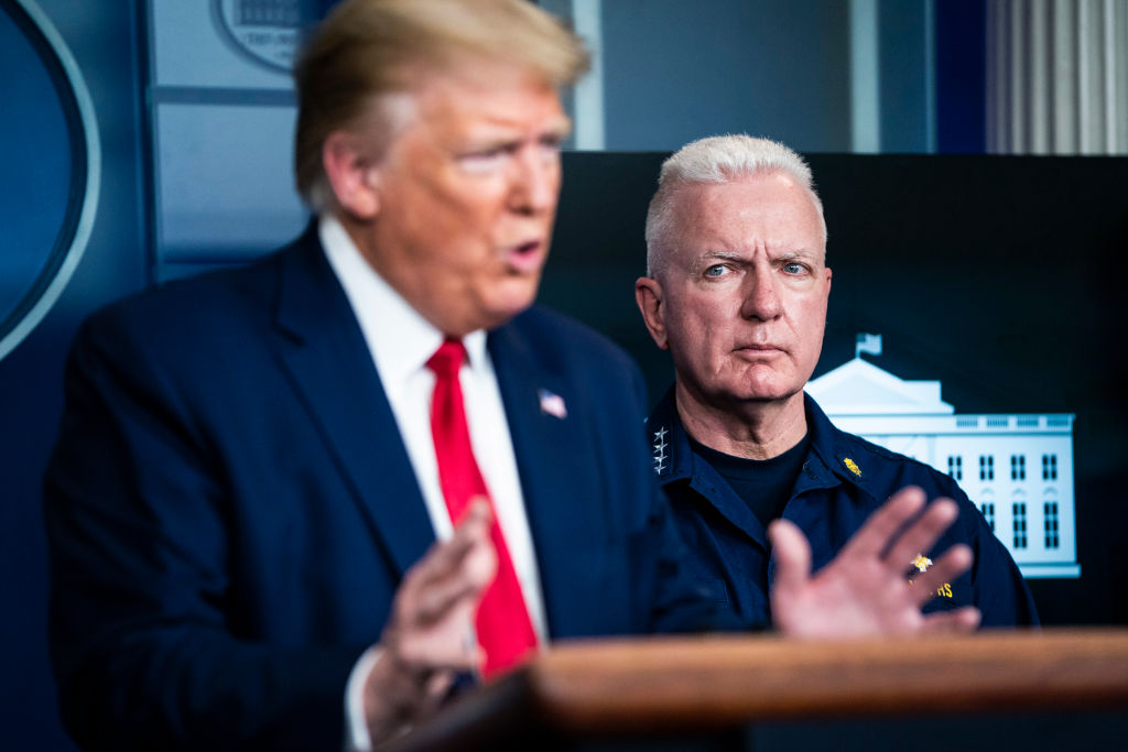Assistant Secretary for Health at the U.S. Department of Health and Human Services Brett Giroir stands behind President Donald J. Trump