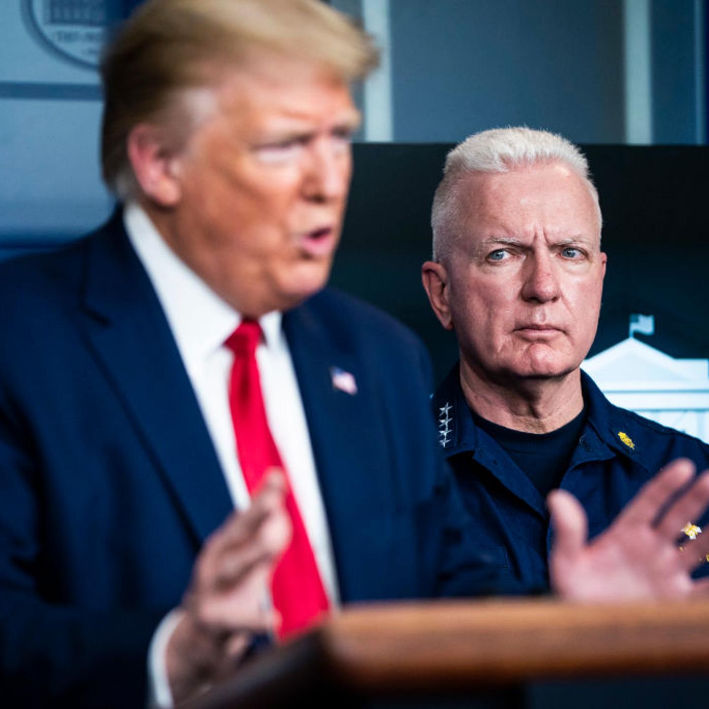 Assistant Secretary for Health at the U.S. Department of Health and Human Services Brett Giroir stands behind President Donald J. Trump