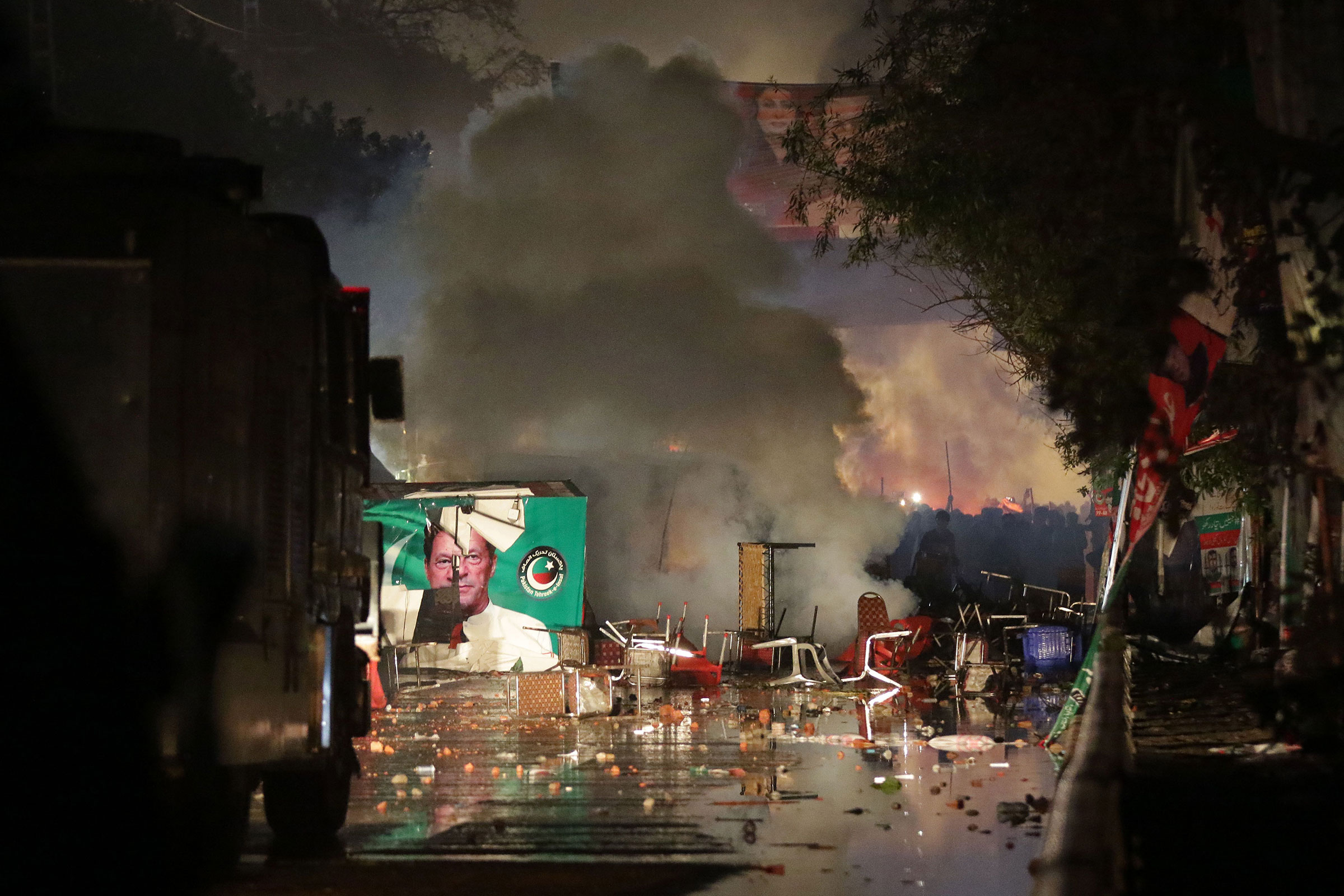 PTI supporters clash with police to avoid arrest of former PM Khan, Lahore, Pakistan - 14 Mar 2023