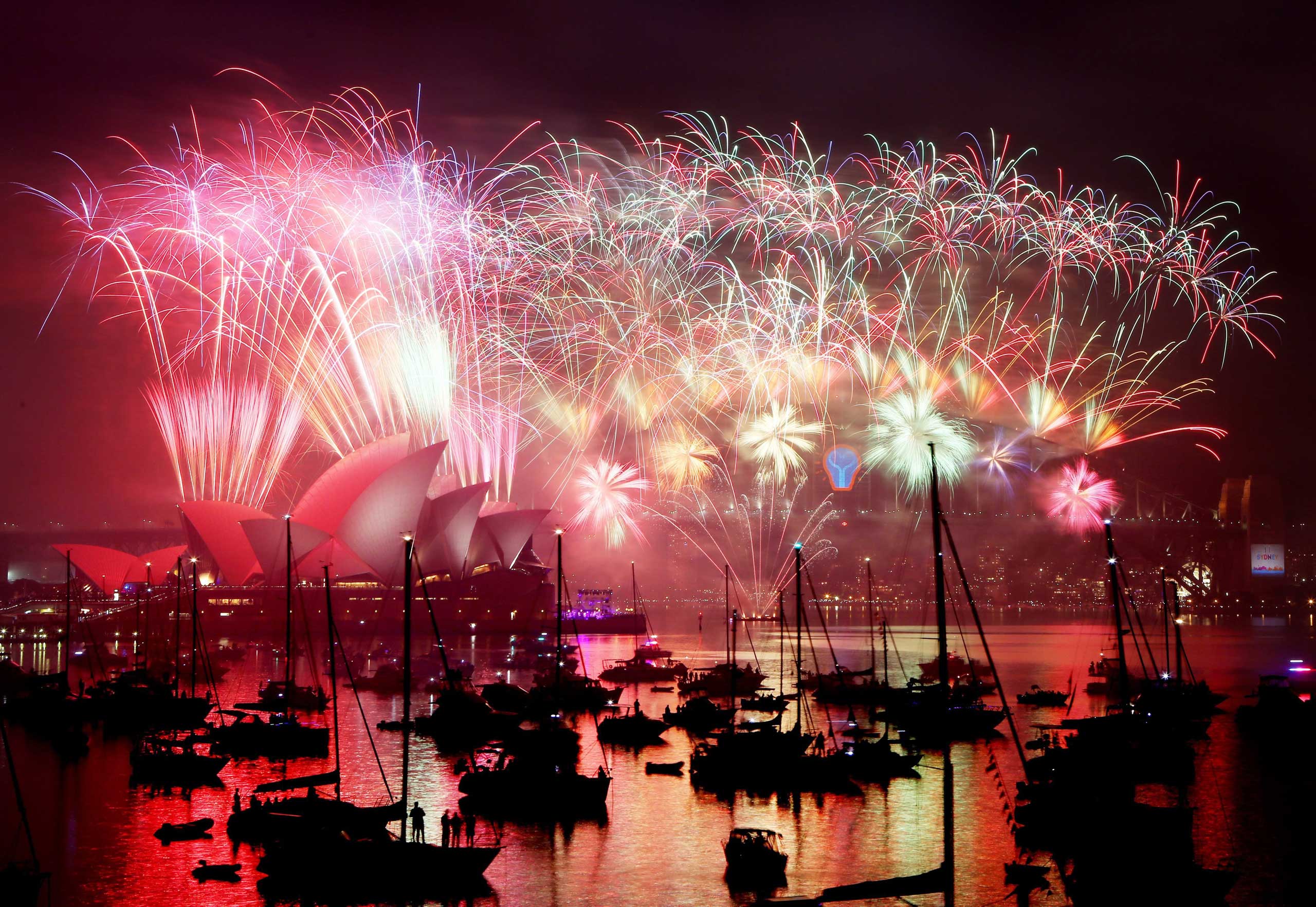 'Midnight Fireworks' explode above the Sydney Opera House and the Harbour Bridge on Jan. 1, 2015.