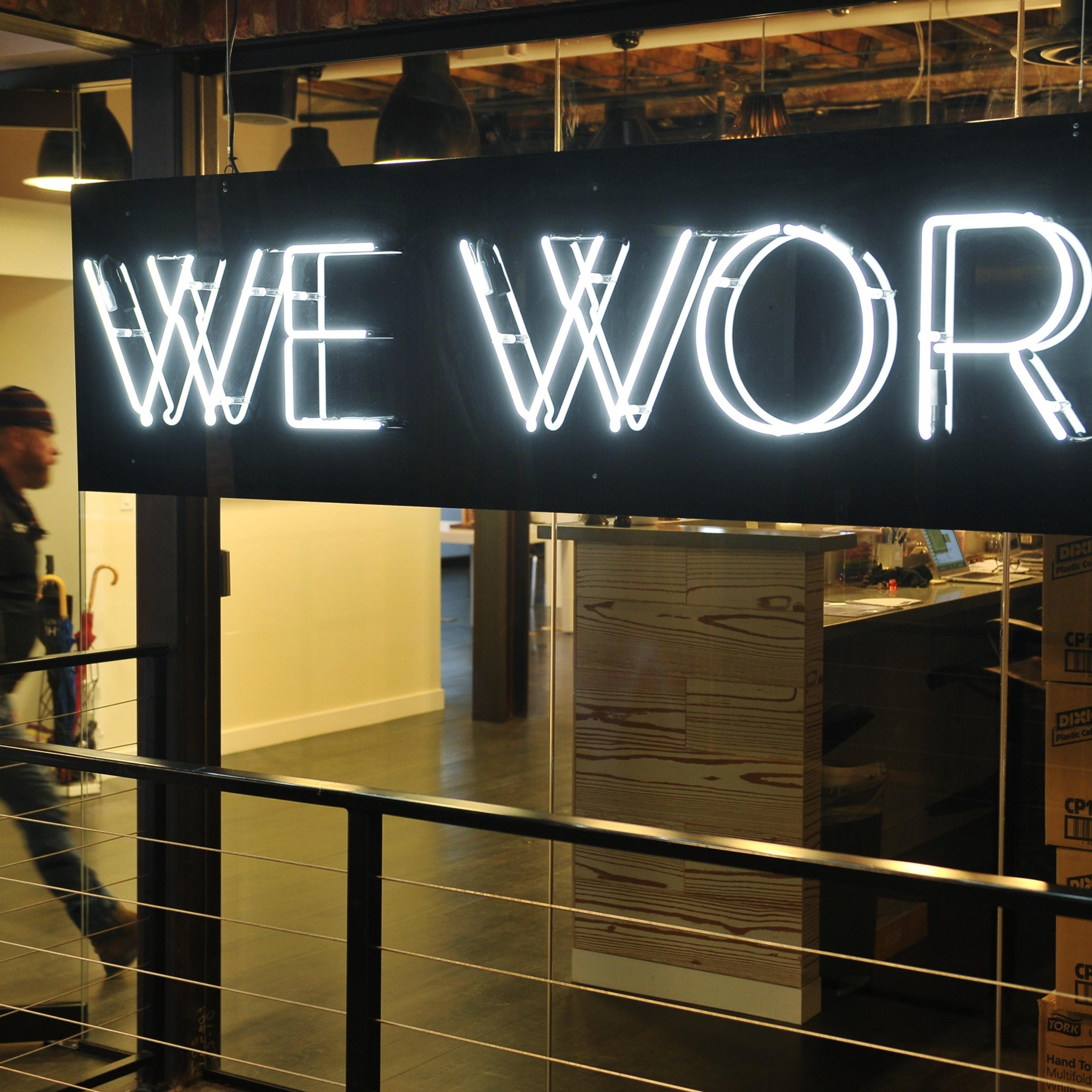 A man enter the doors of the "WeWork" co-operative co-working space on March 13, 2013 in Washington, DC.