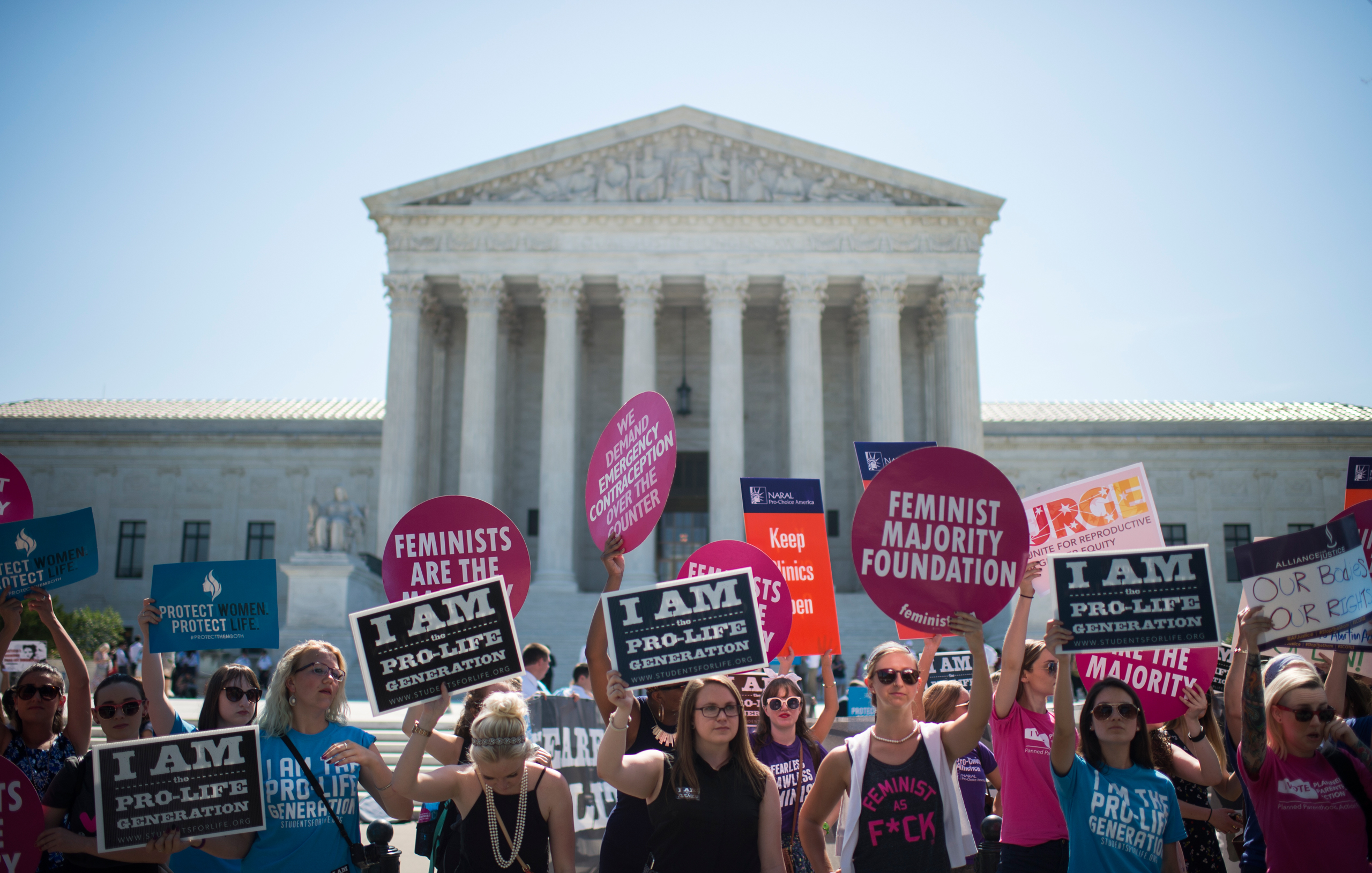 Pro-choice and pro-life demonstrators rally outside of the U.S. Supreme Court on Monday morning, June 20, 2016. The court is expected to hand down their decision on a Texas law which requires clinics to meet the same standards as ambulatory surgical cent