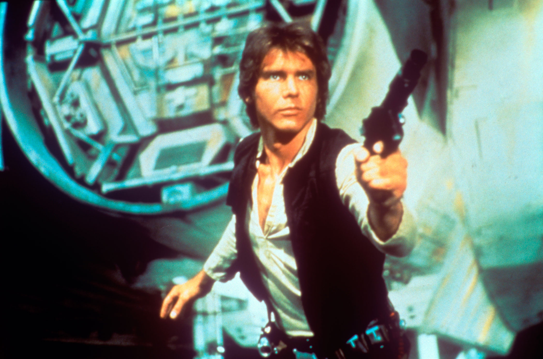 Harrison Ford drawing a gun