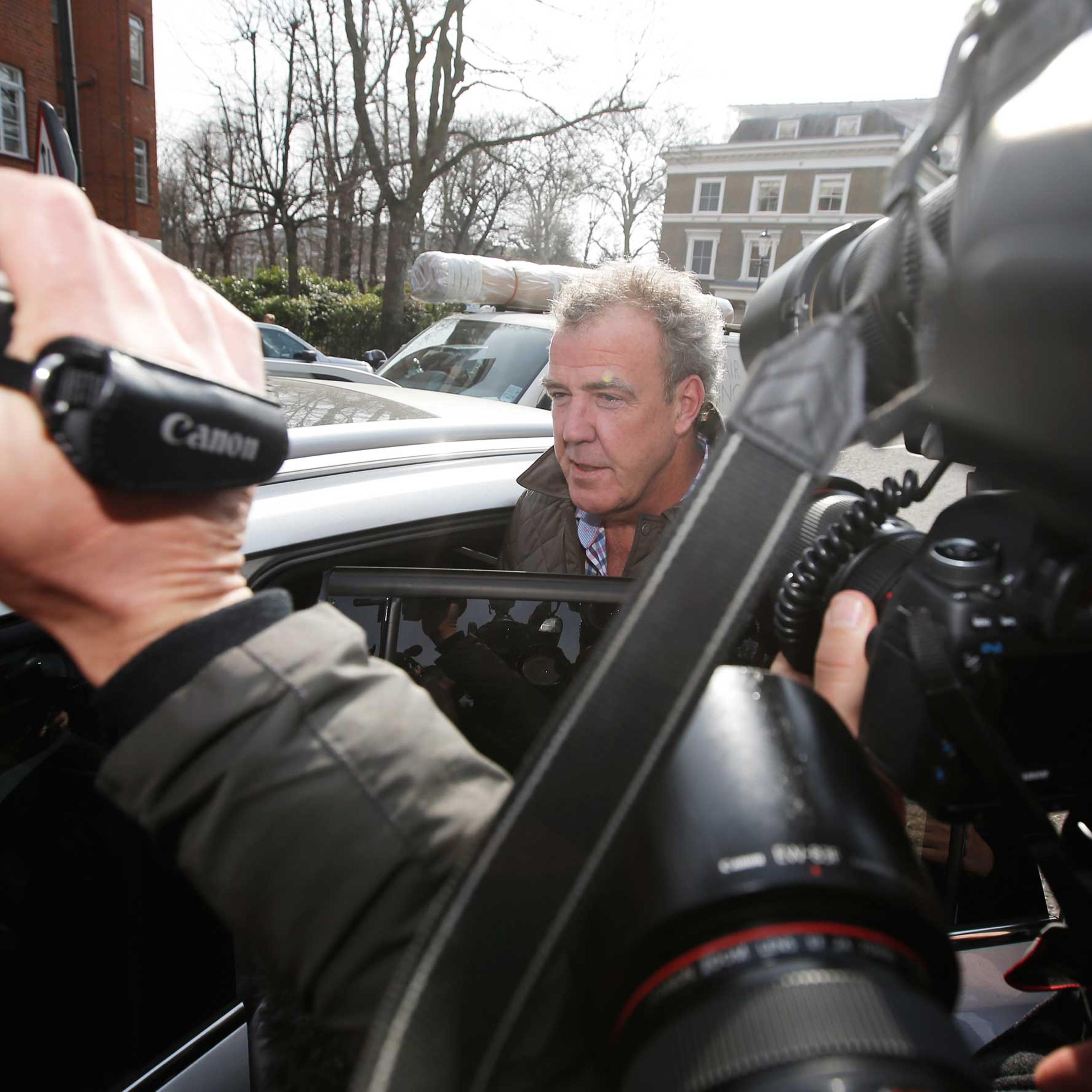 Television presenter Jeremy Clarkson is mobbed by journalists as he leaves an address in London, March 11, 2015.
