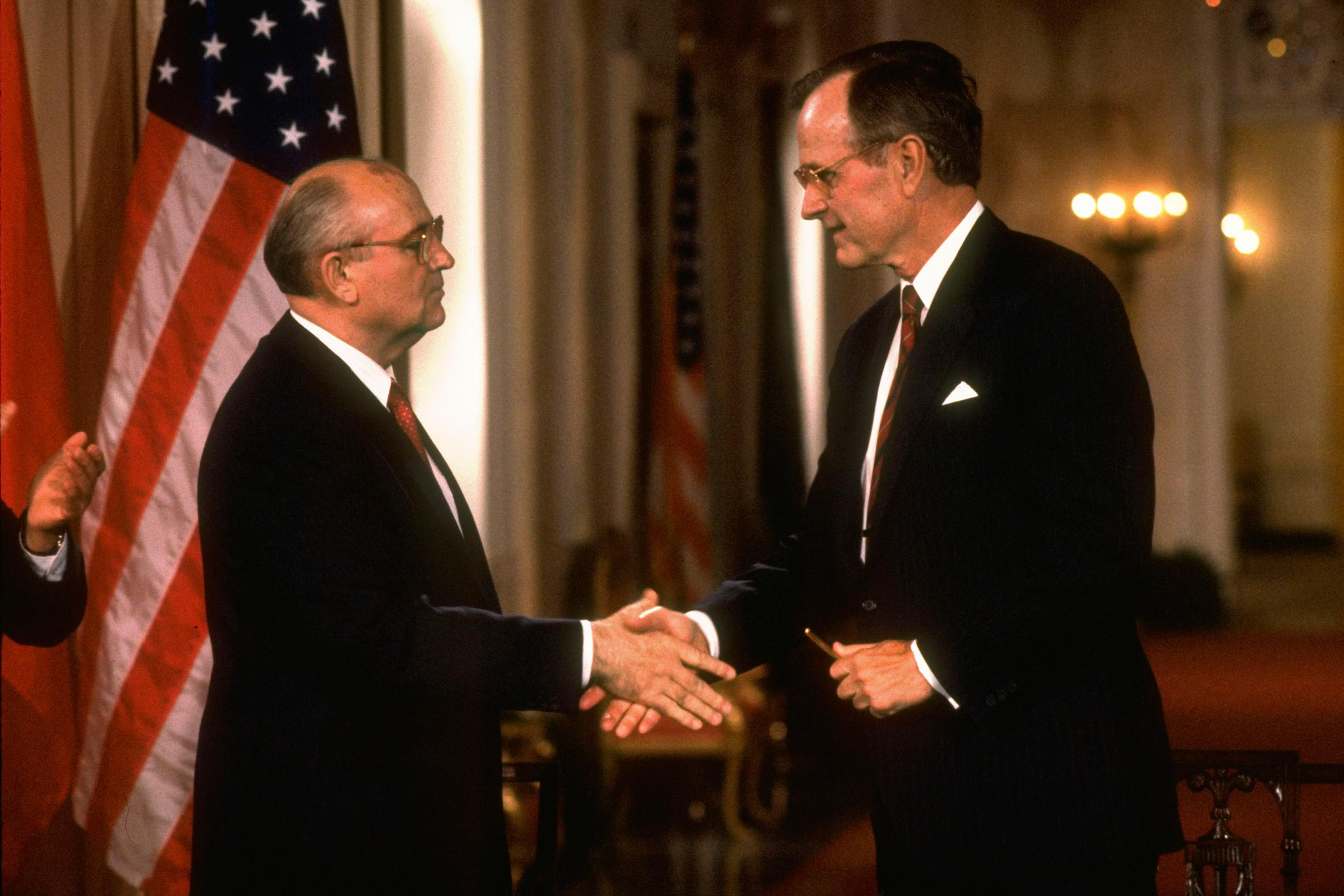 Gorbachev, left, shakes Bush’s hand after signing an agreement on June 1, 1990
