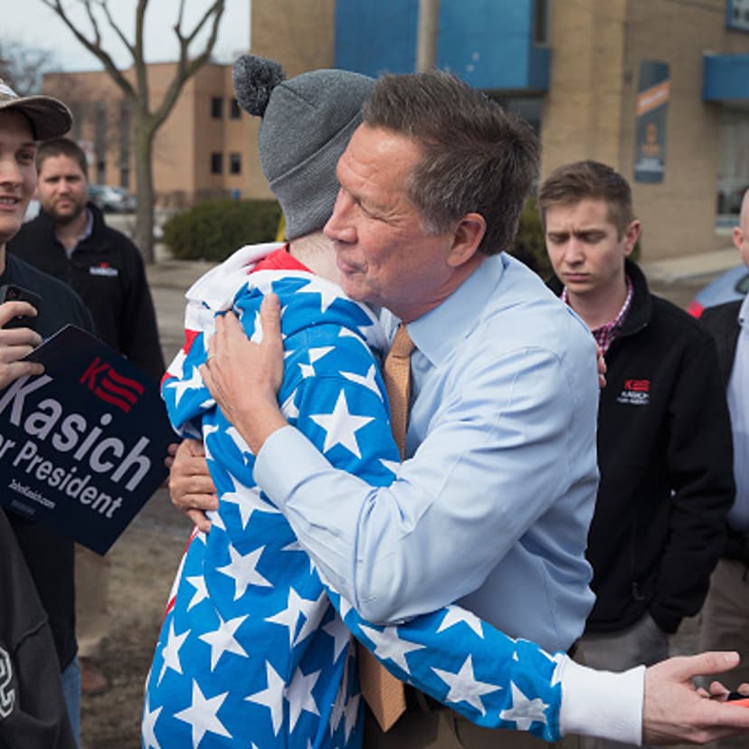 Republican presidential candidate Ohio Gov. John Kasich greets supporters following a rally at the Lansing Brewing Company on March 8, 2016 in Lansing, Michigan.