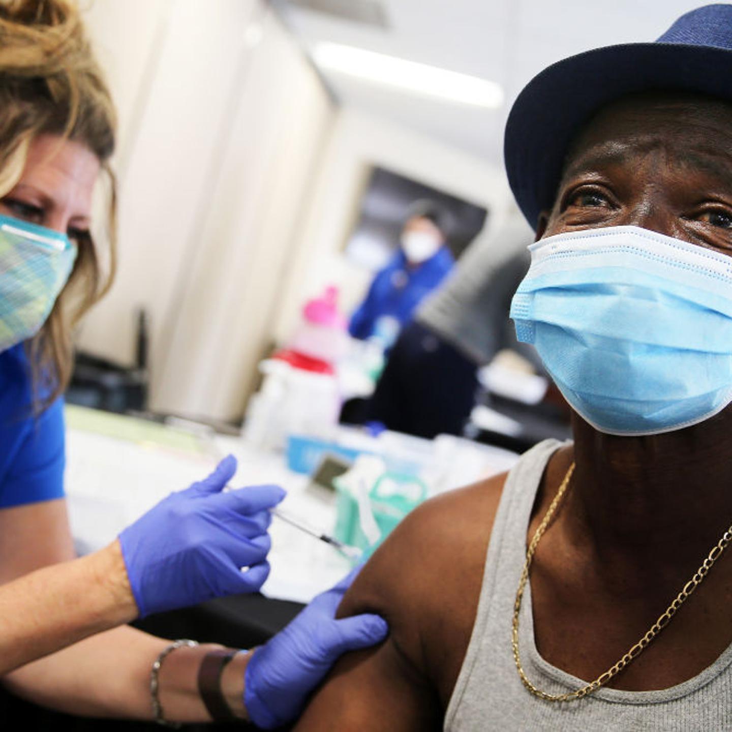 Larry Green receives his second dose of the Moderna COVID-19 vaccine from registered nurse Teresa Frey at Lincoln Memorial Congregational Church UCC on March 12, 2021 in Los Angeles, California.