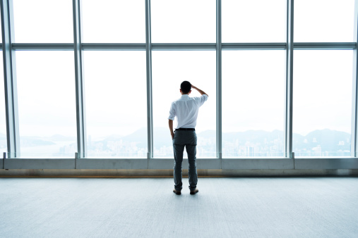 businessman-looking-out-window