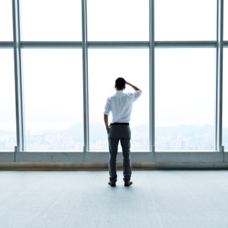 businessman-looking-out-window