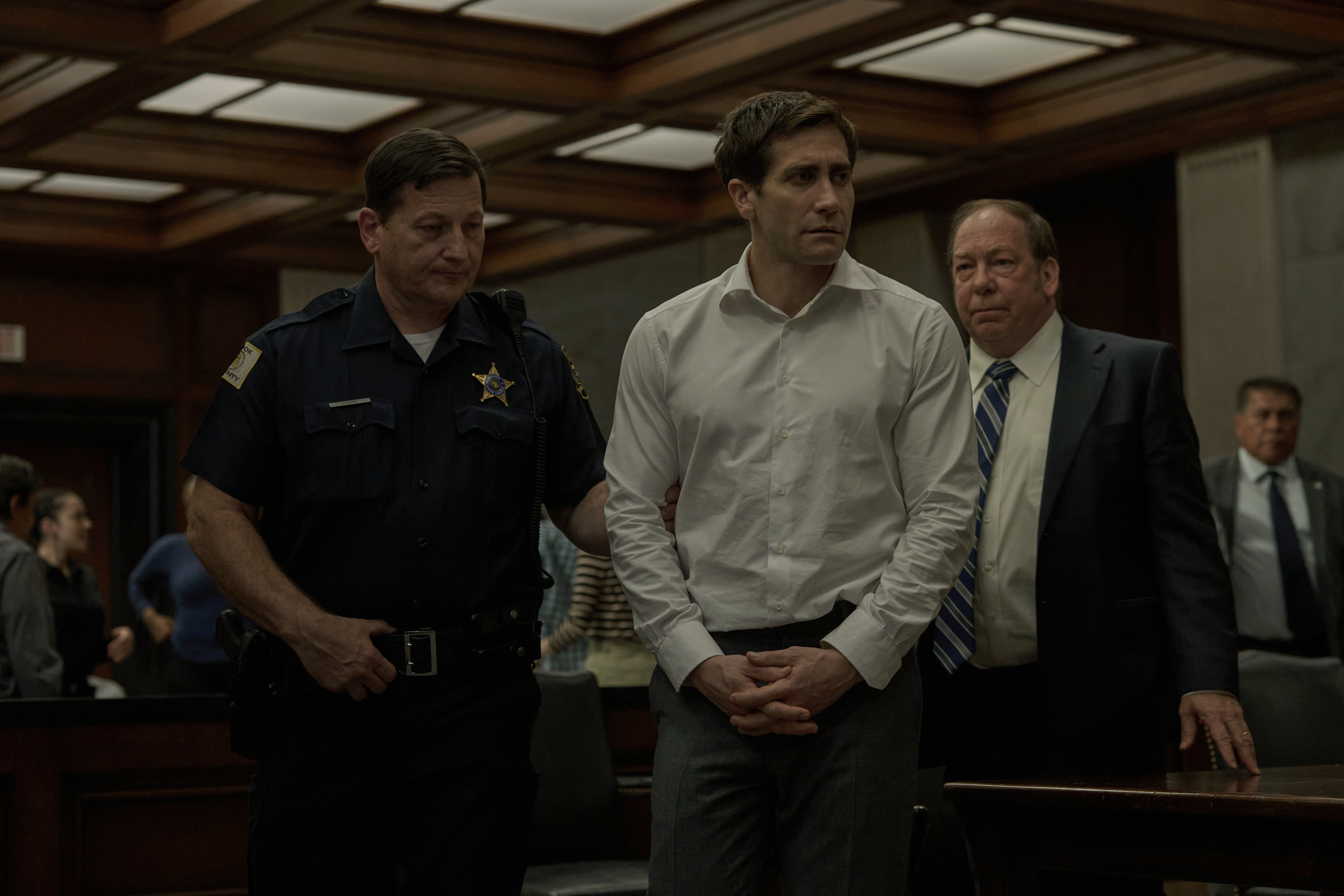 Jake Gyllenhaal, center, and Bill Camp, right, in <i>Presumed Innocent</i>