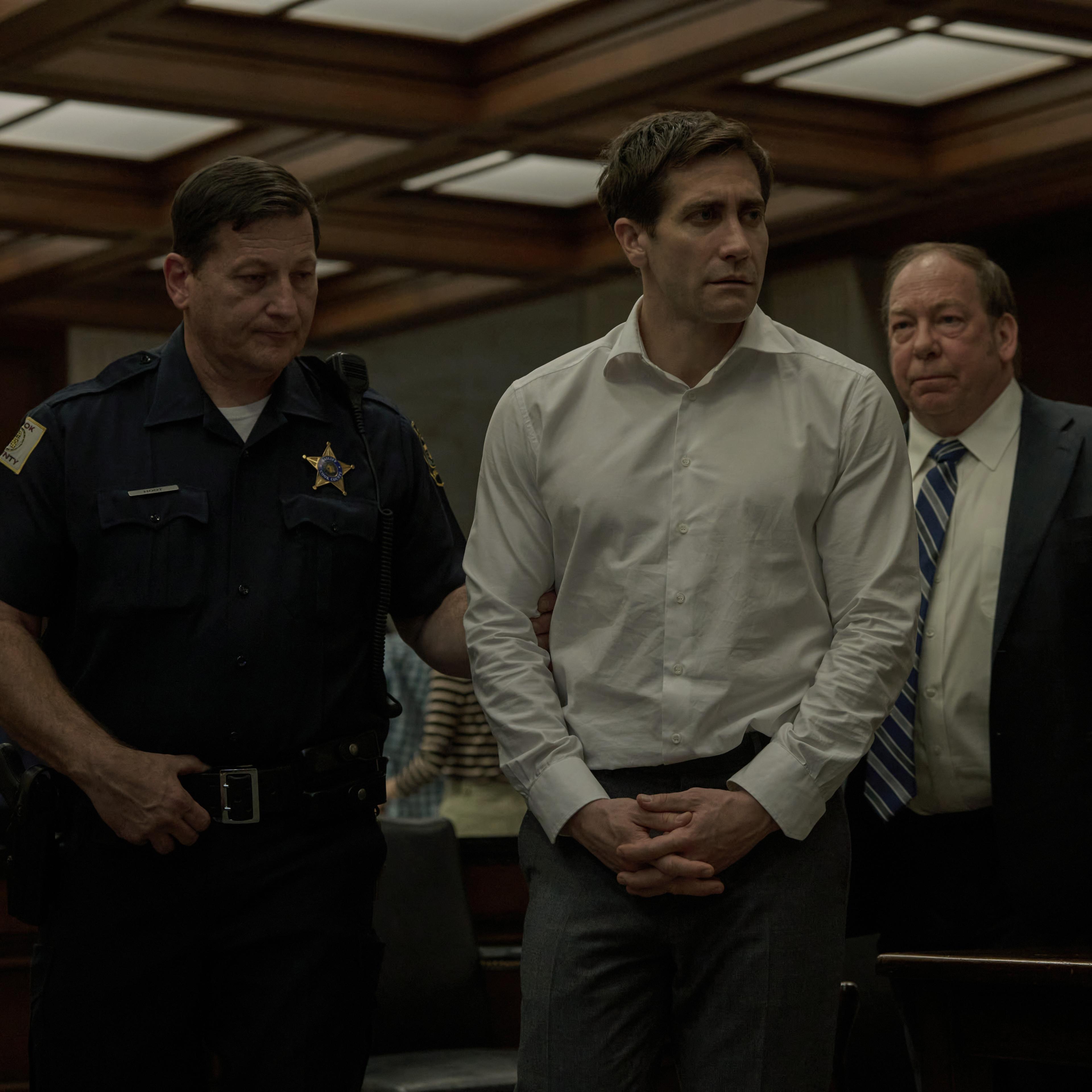 Jake Gyllenhaal, center, and Bill Camp, right, in <i>Presumed Innocent</i>