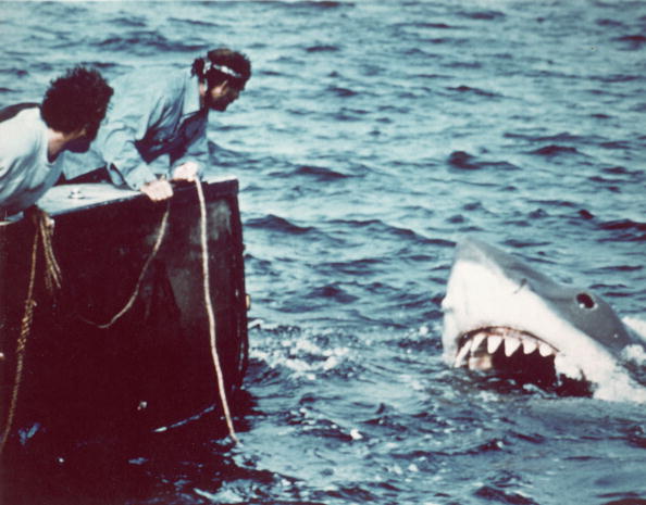 Richard Dreyfuss (left) (as marine biologist Hooper) and Robert Shaw (as shark fisherman Quint) look off the stern of Quint's fishing boat the 'Orca' at the terrifying approach of the mechanical giant shark dubbed 'Bruce' in a scene from the film 'Jaws.'