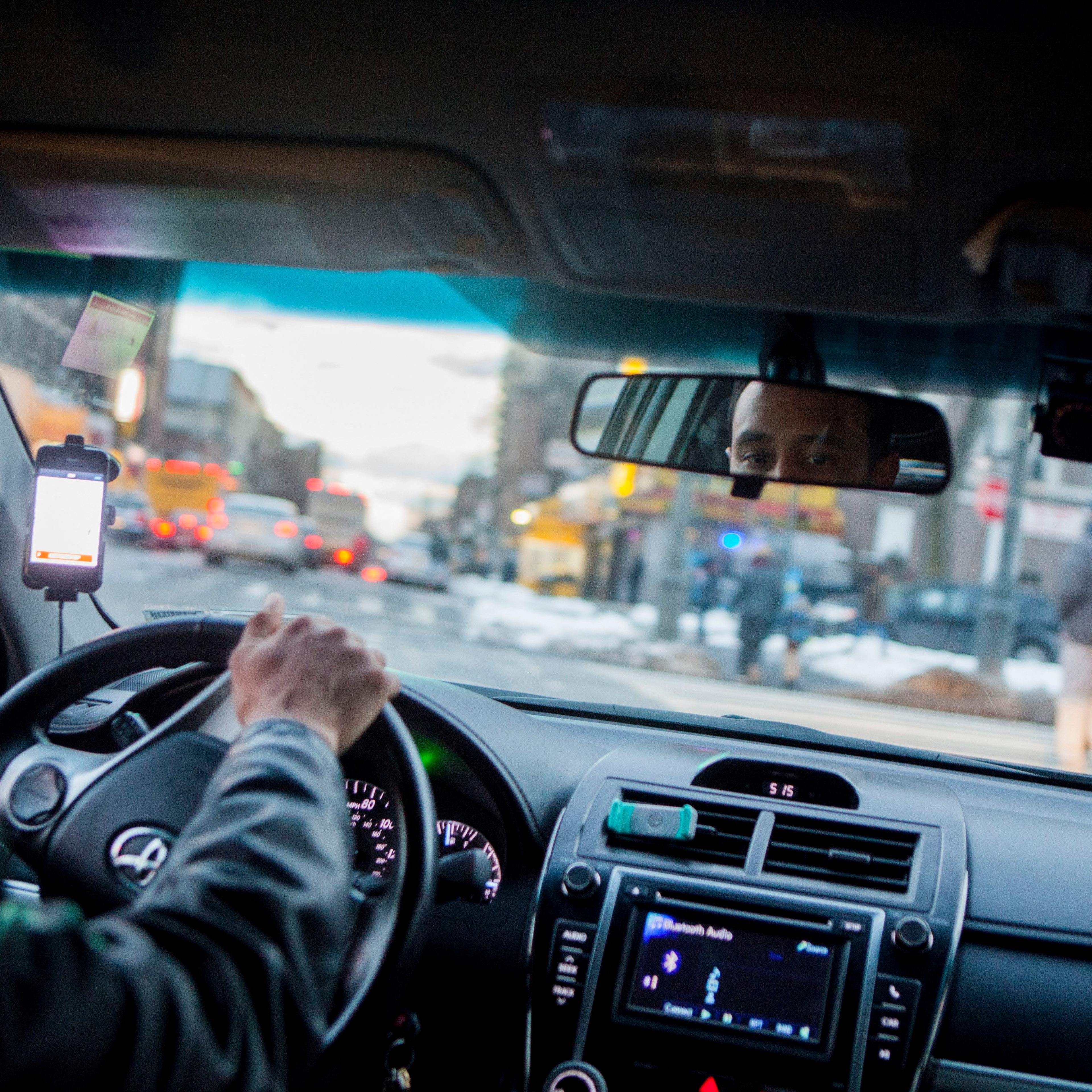An Uber driver navigates the streets of Brooklyn?s Crown Heights neighborhood.