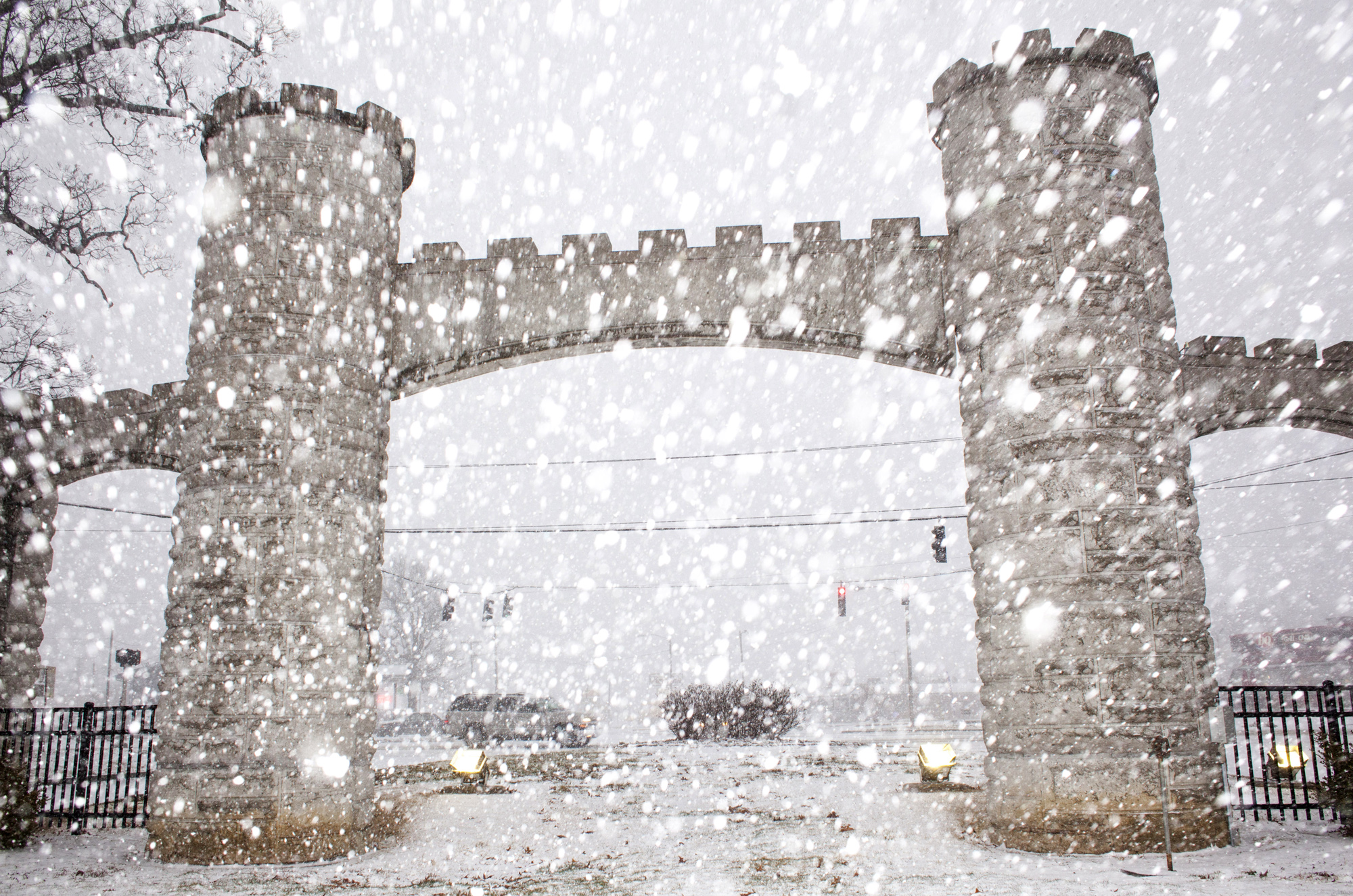 Snow falls near the entrance of Noble Park, Wednesday, March 4, 2015, in Paducah, Ky