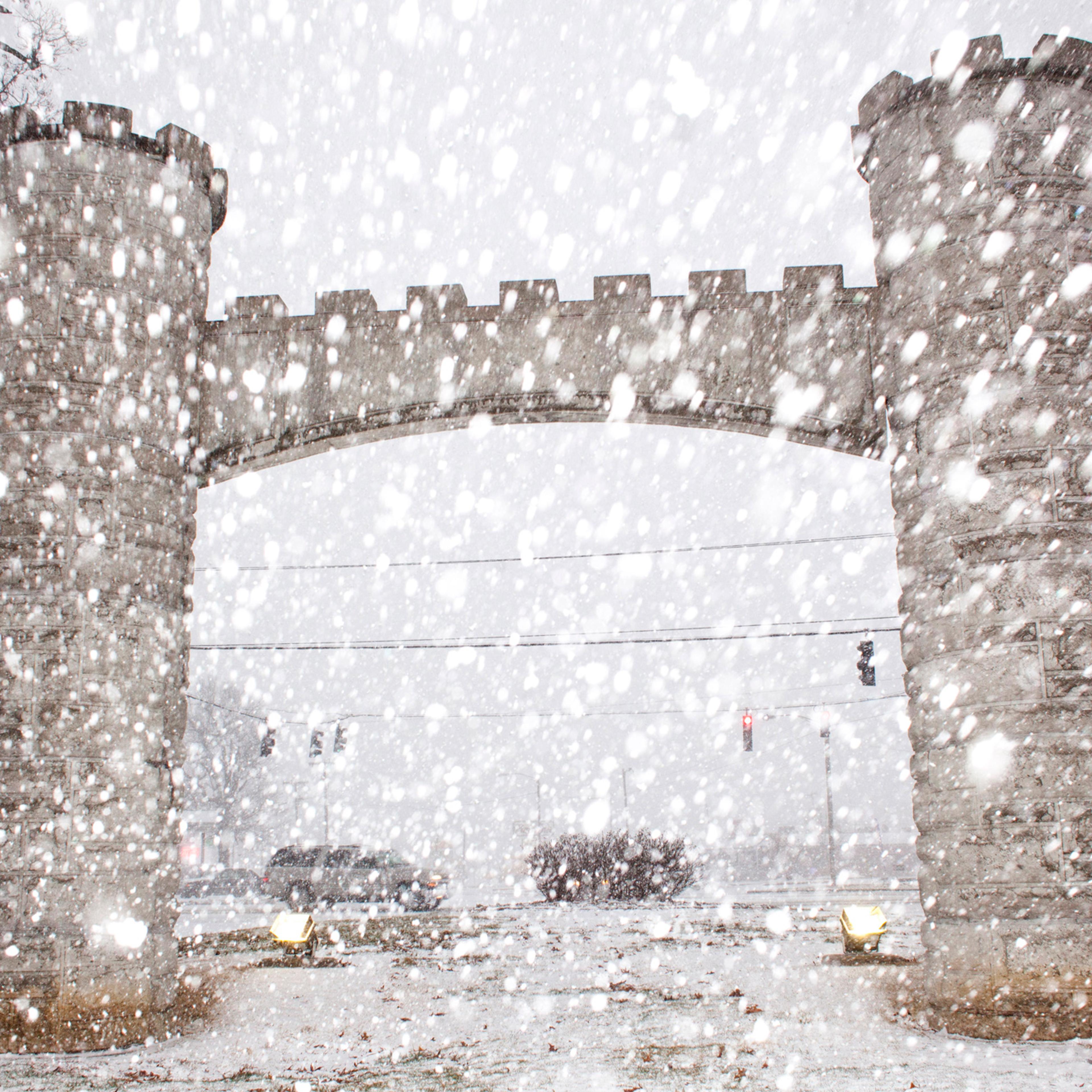 Snow falls near the entrance of Noble Park, Wednesday, March 4, 2015, in Paducah, Ky