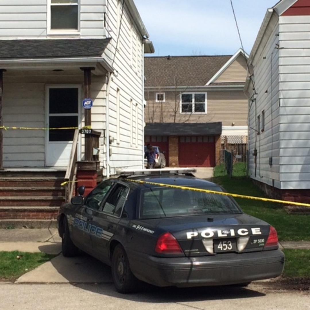 Authorities investigate the scene after a shooting involving two children Sunday, April 12, 2015, in Cleveland.