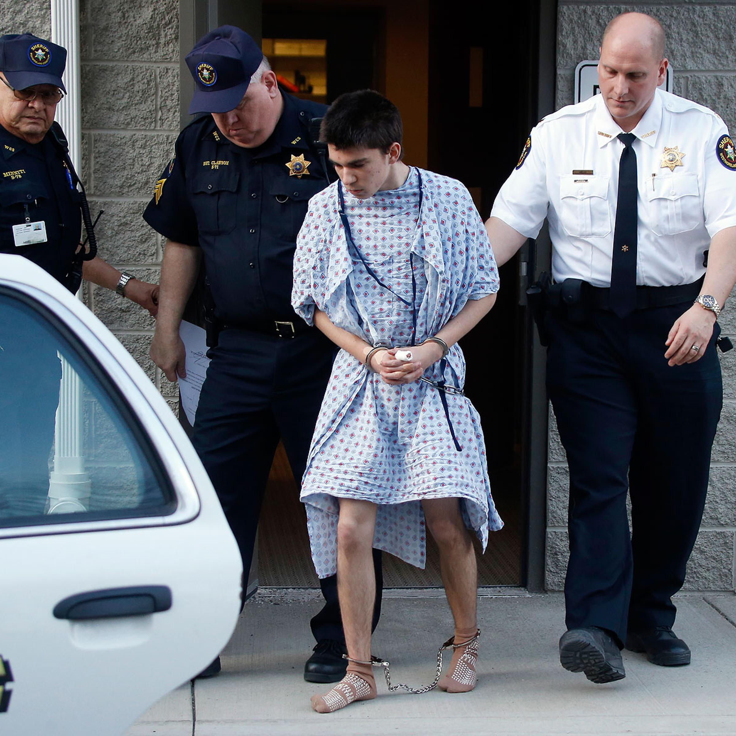 Alex Hribal, the suspect in the stabbings at the Franklin Regional High School near Pittsburgh, is taken from a district magistrate after he was arraigned on charges in the attack on April 9, 2014 in Export, Pa.