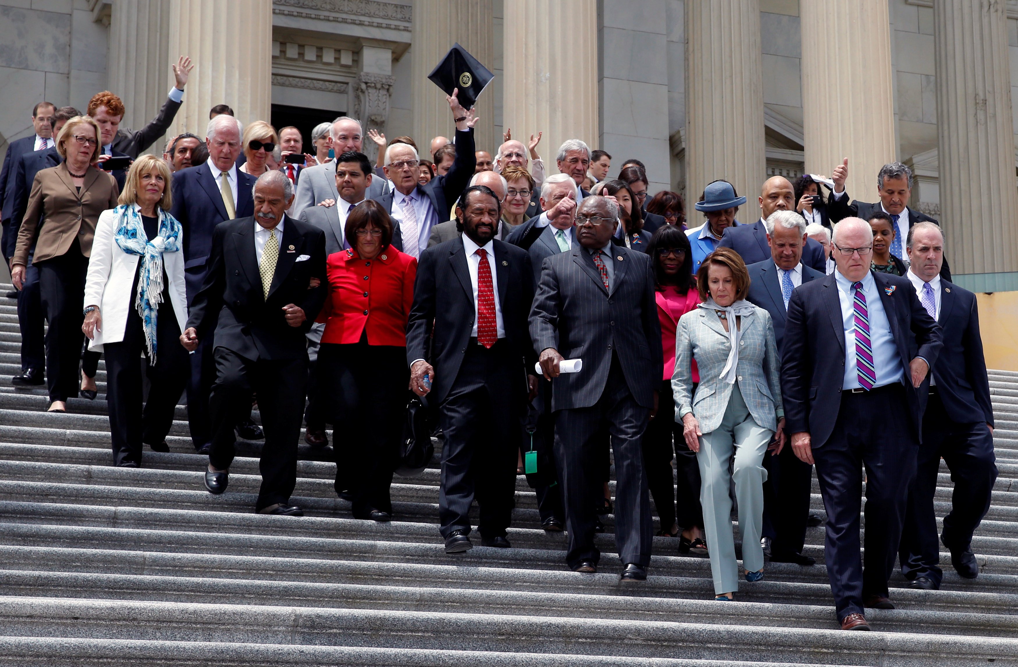 U.S. House Democrats walk out on the East Front on Capitol Hill in Washington, U.S., after their sit-in over gun-control law