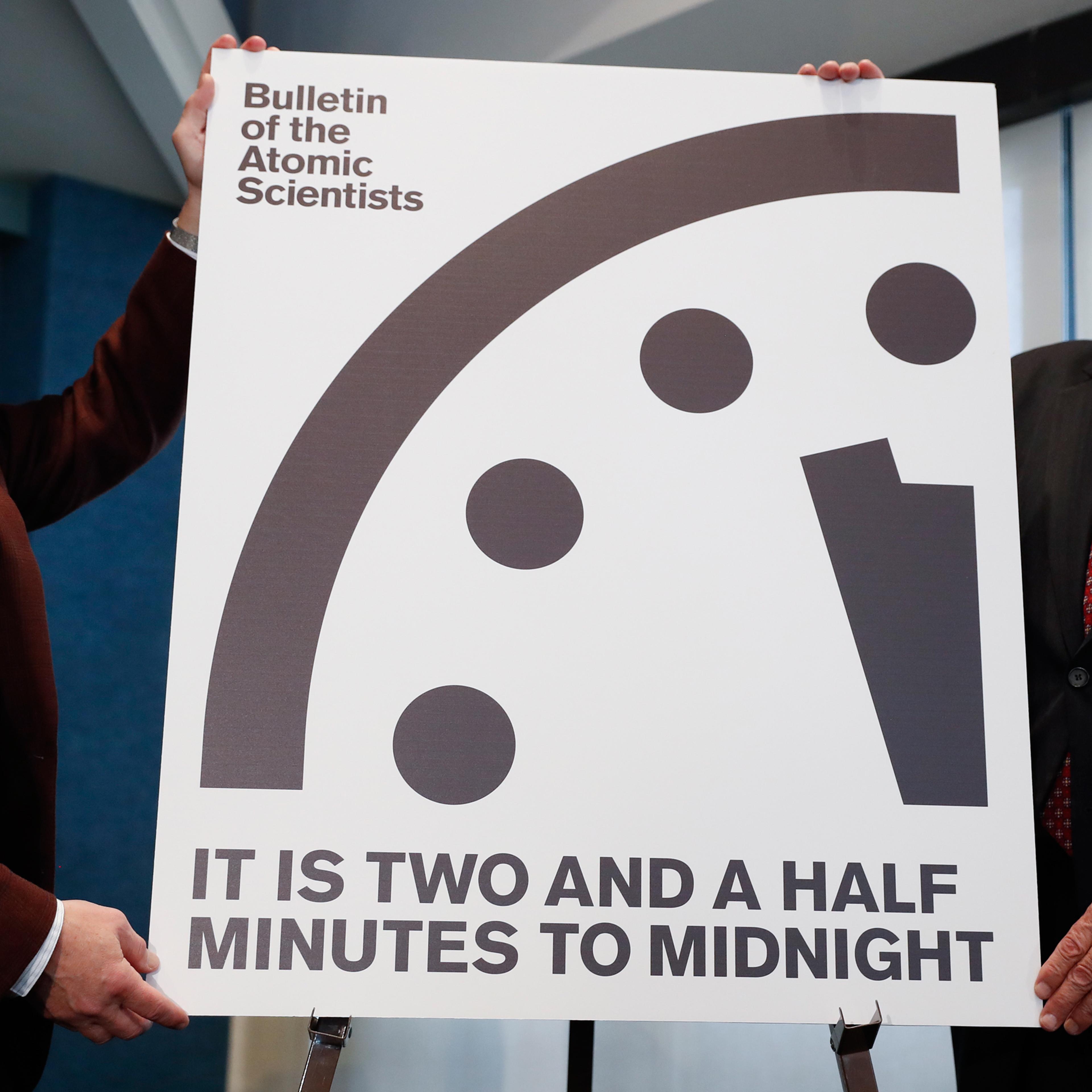 Lawrence Krauss, theoretical physicist, chair of the Bulletin of the Atomic Scientists Board of Sponsors, left, and Thomas Pickering, co-chair of the International Crisis Group, display the Doomsday Clock during a news conference the at the National Pres