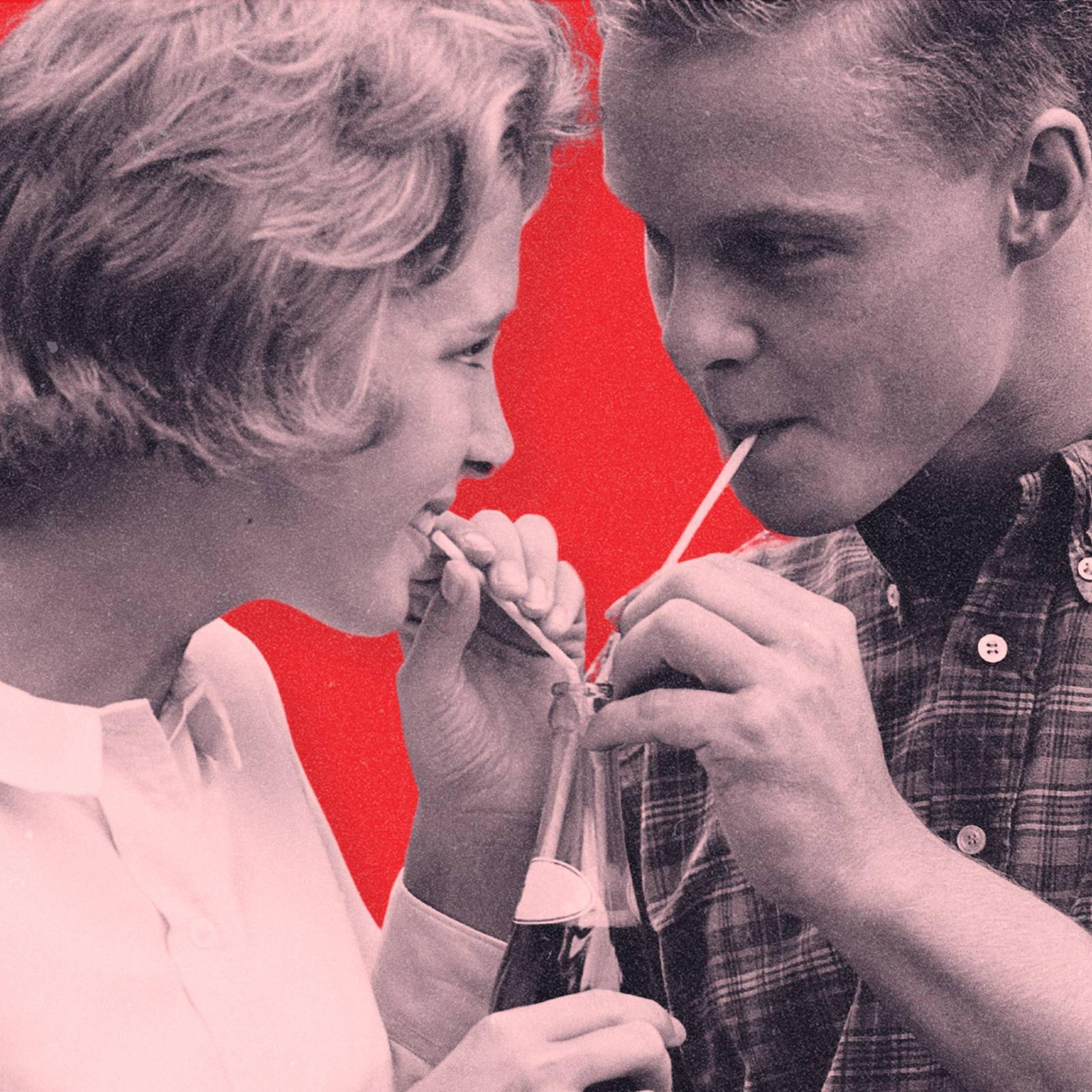 A vintage photograph of a couple drinking out of a soda bottle with two straws