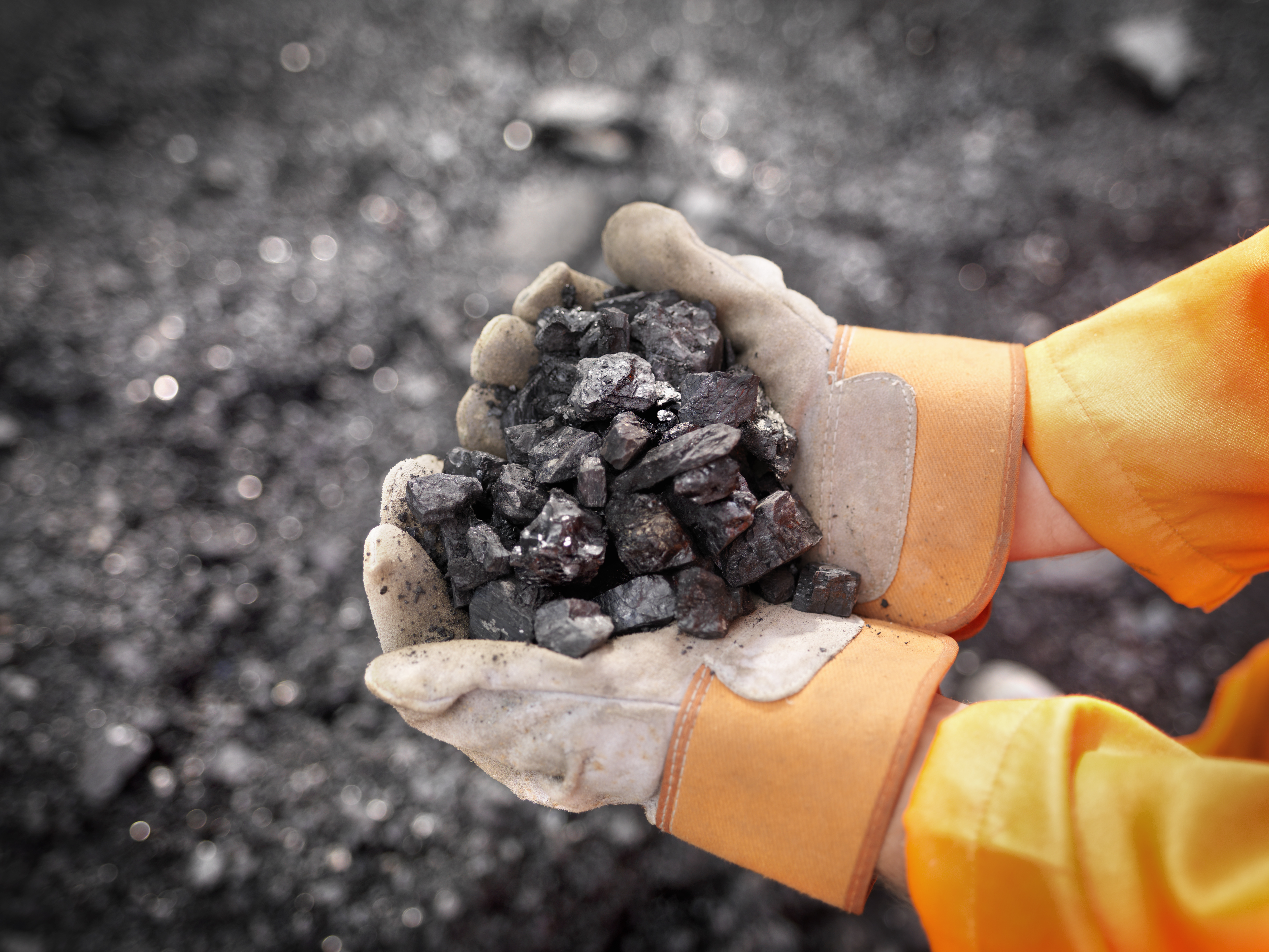 man-holding-coal