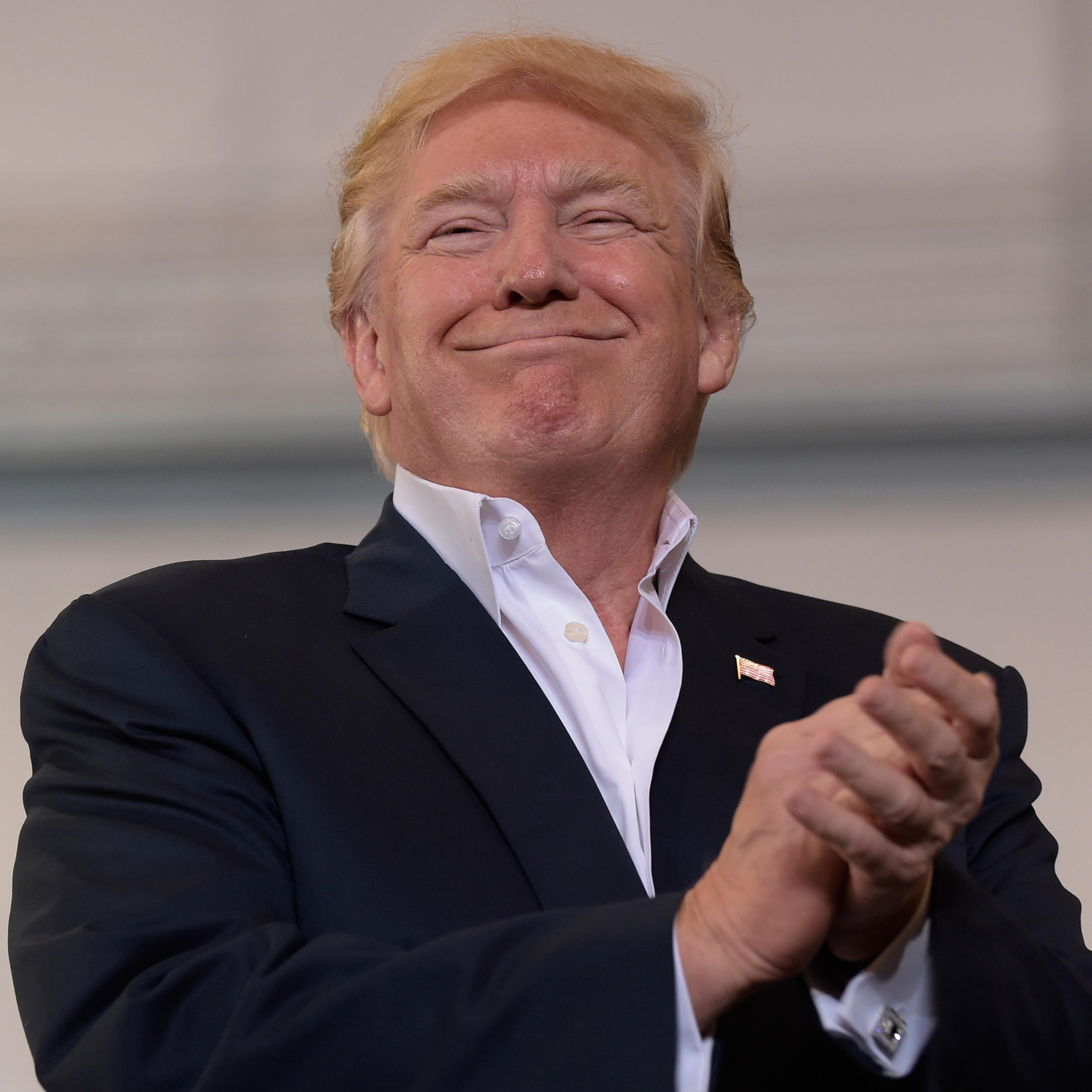 President Donald Trump smiles as he prepares to speak at his "Make America Great Again Rally" at Orlando-Melbourne International Airport in Melbourne, Fla., Saturday, Feb. 18, 2017. (AP Photo/Susan Walsh)