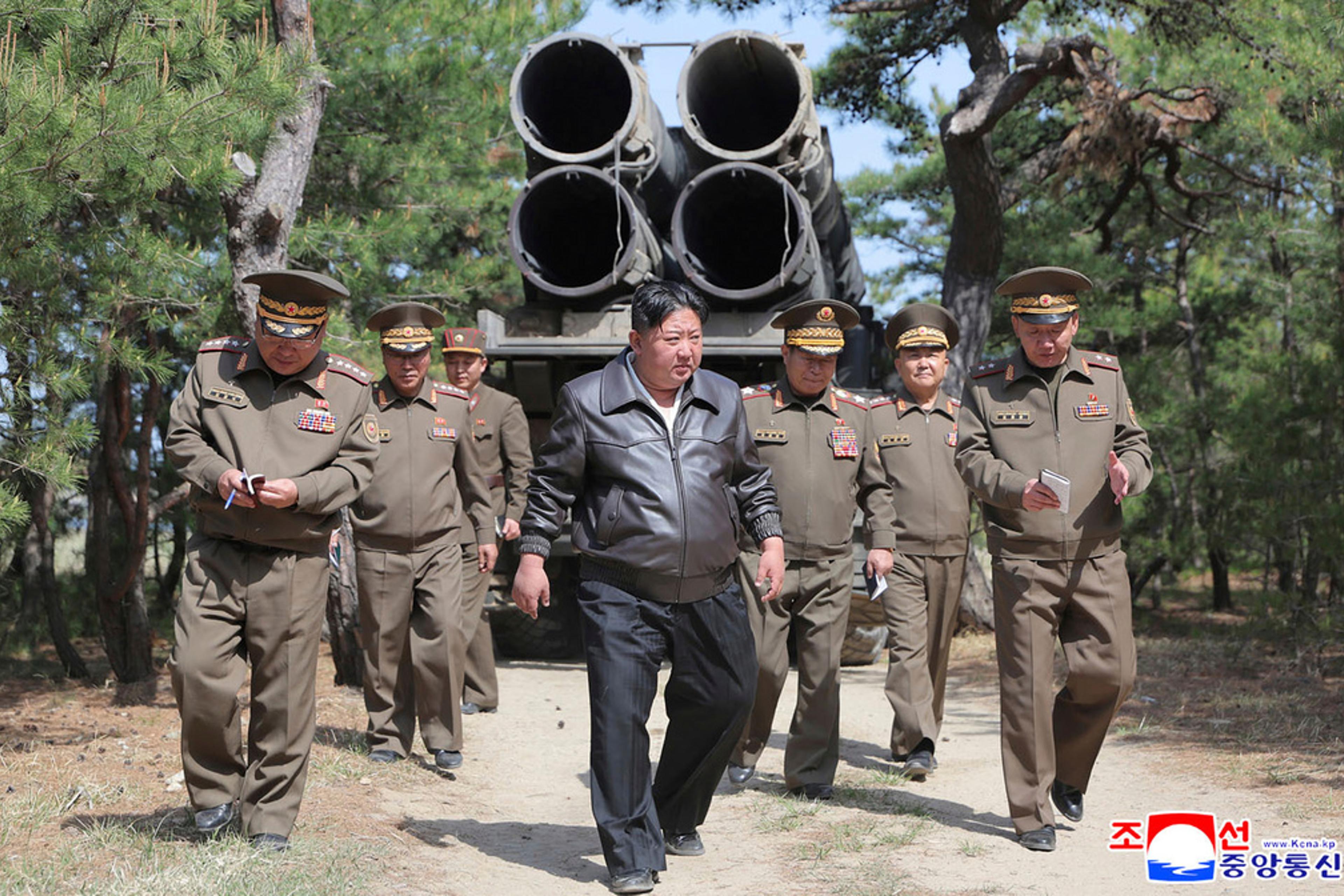 In this photo provided by the North Korean government, North Korean leader Kim Jong Un, center, supervises a drill of long-range artillery and missile systems at North Korea’s eastern coast on May 8, 2025.