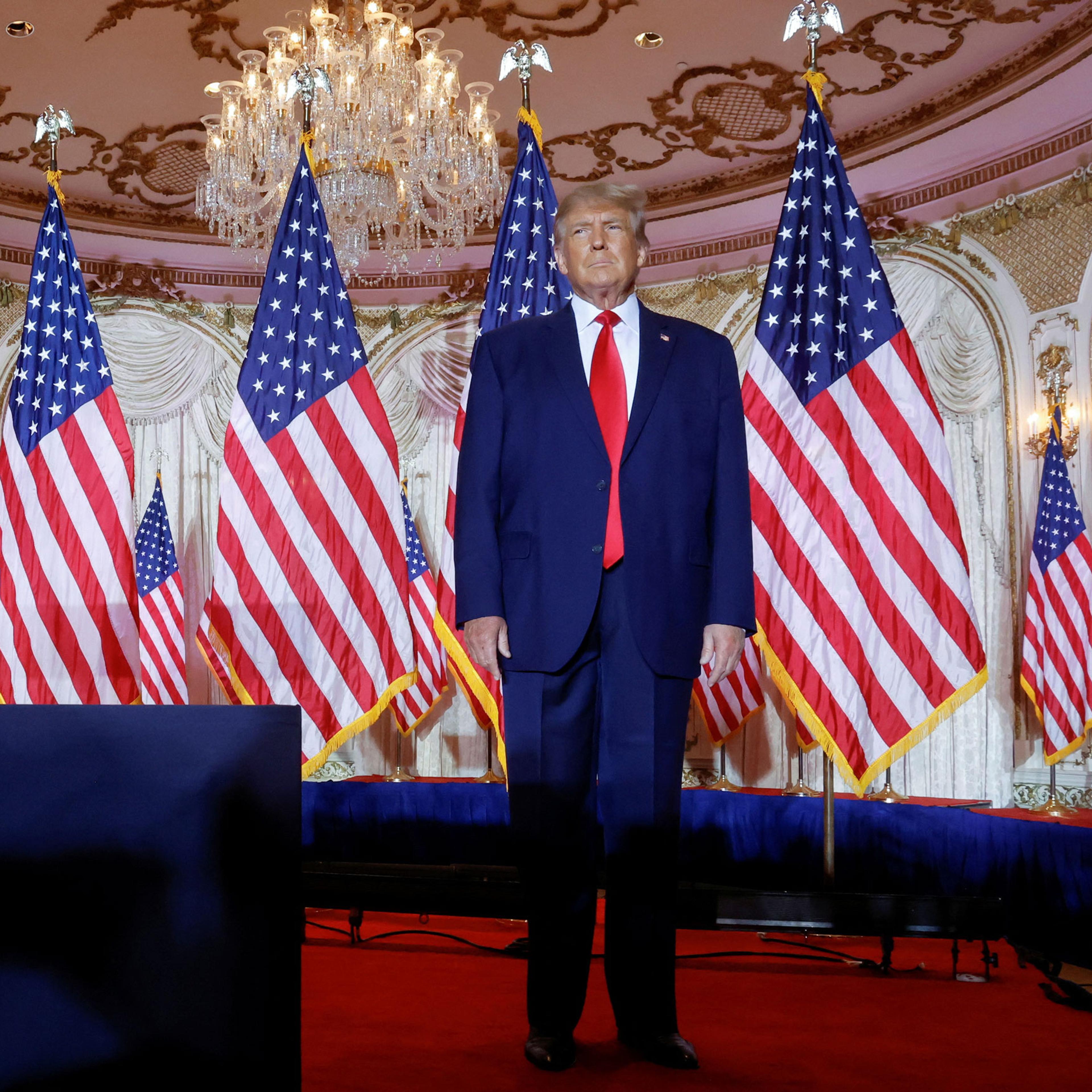 Former U.S. President Donald Trump stands onstage listening to applause as he arrives to announce that he will once again run for U.S. president in the 2024 U.S. presidential election during an event at his Mar-a-Lago estate in Palm Beach, Florida, on No