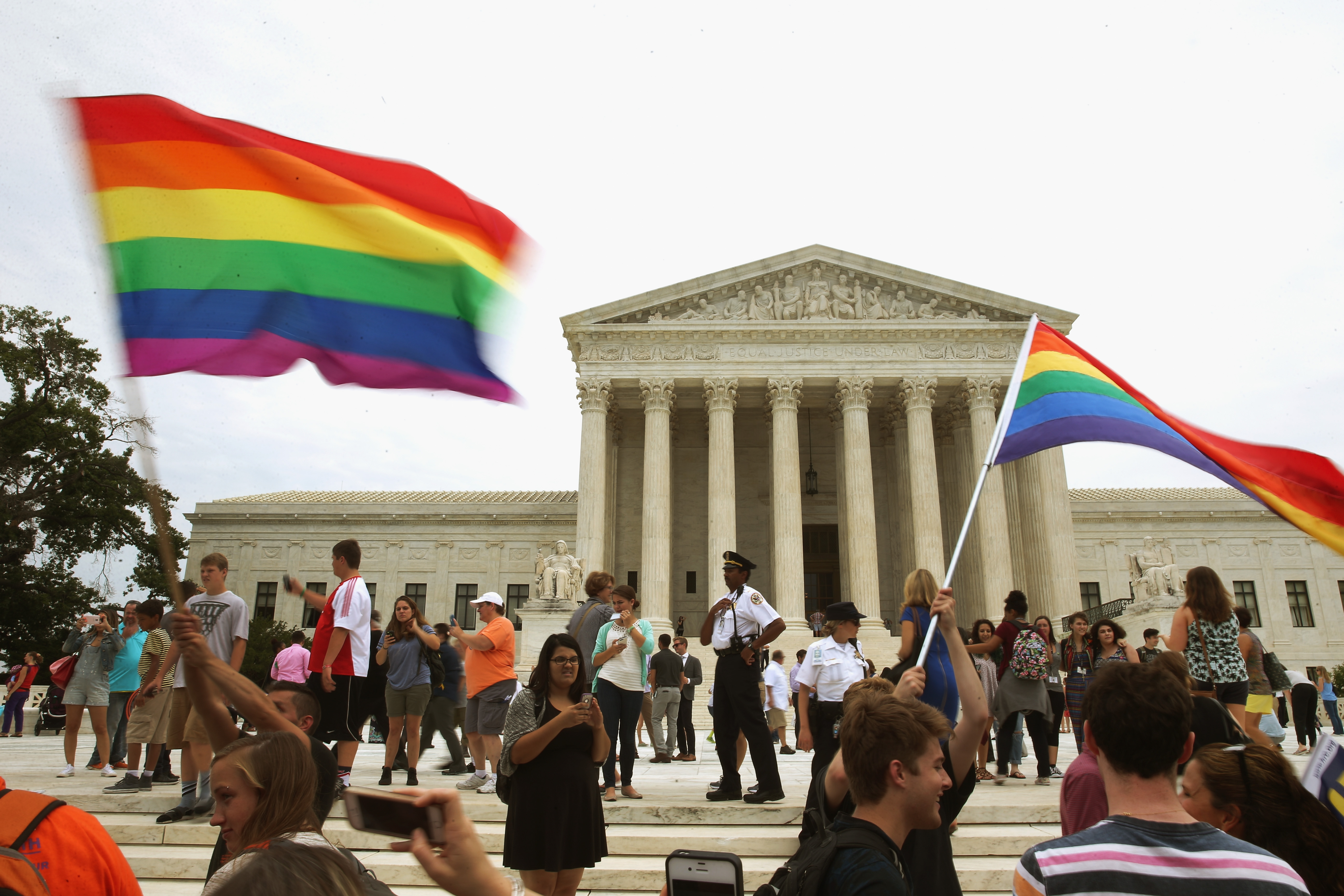 People celebrate in front of the U.S. Supreme Court after the ruling in favor of same-sex marriage June 26, 2015 in Washington, DC.