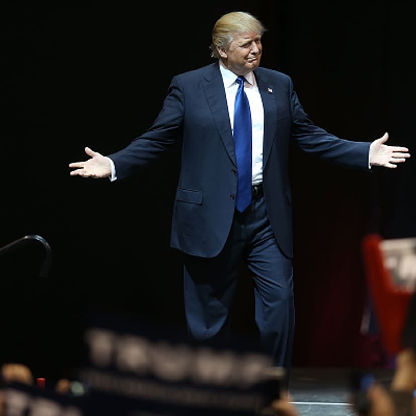 Republican presidential candidate Donald Trump arrives on stage during a campaign rally at Verizon Wireless Arena in Manchester, New Hampshire, on Feb. 8, 2016.