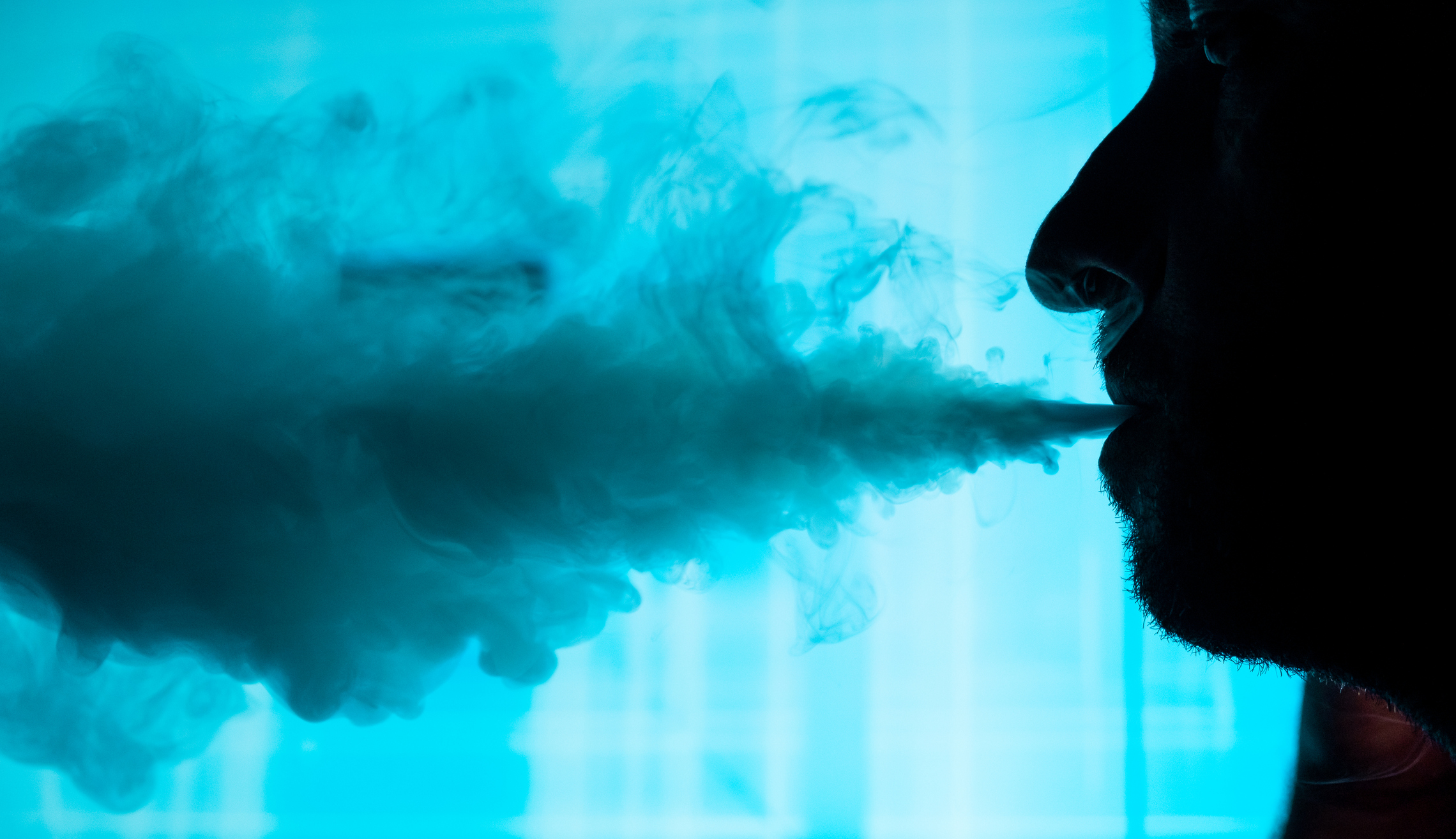 Man smokes an electronic cigarette