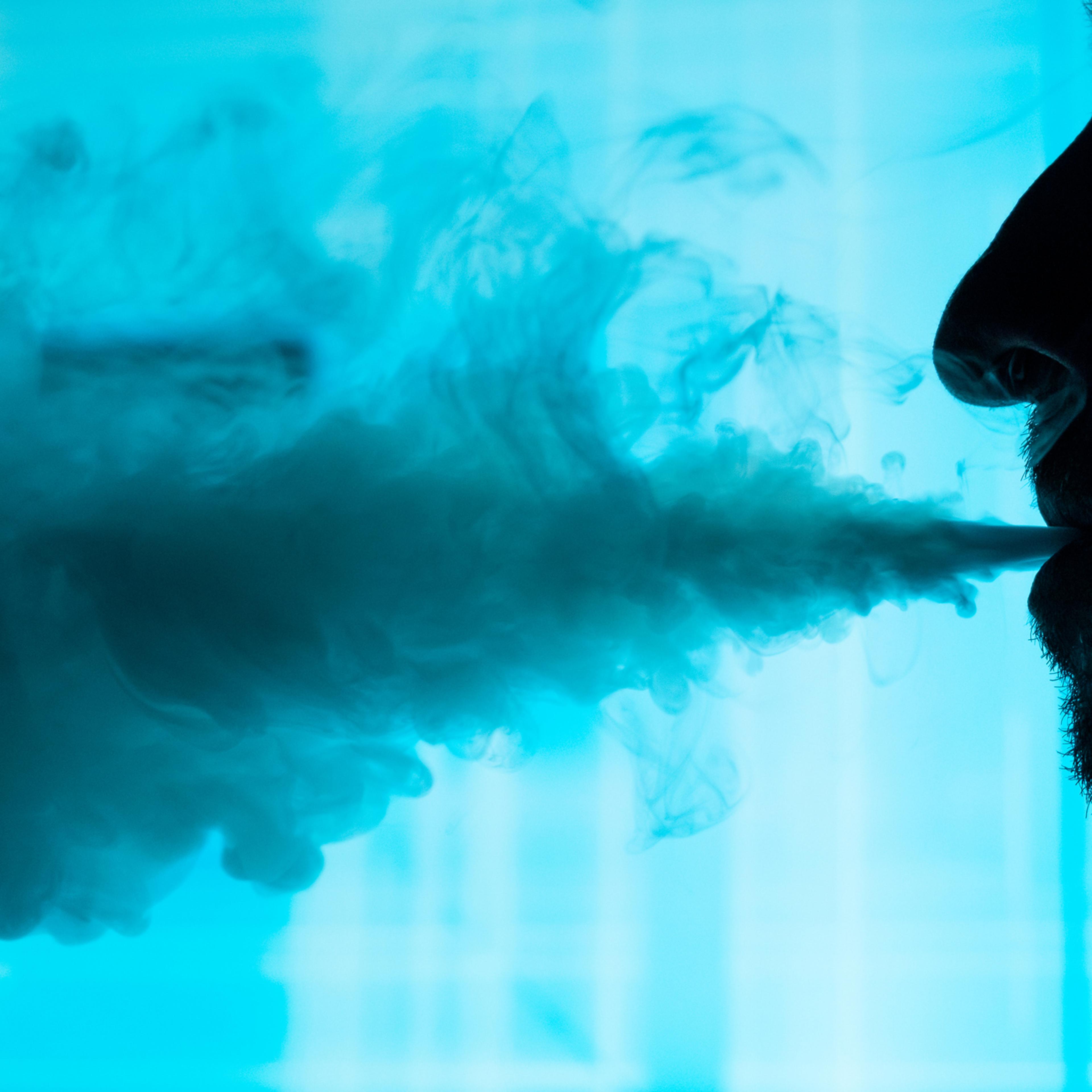 Man smokes an electronic cigarette