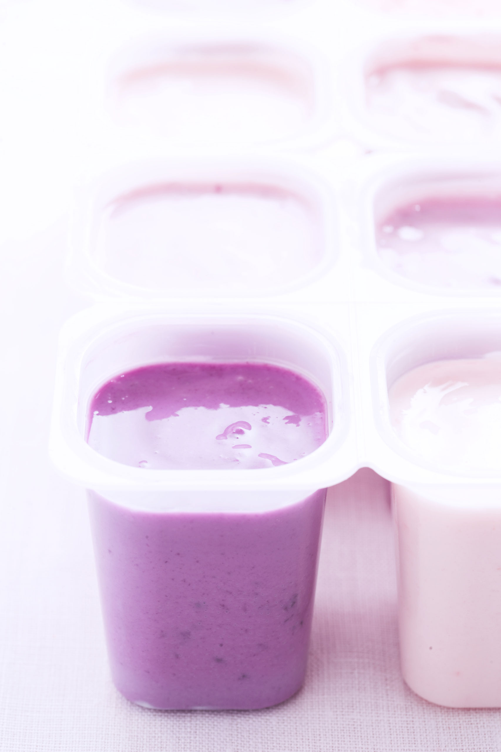 Opened cartons of fruit yoghurts, close-up