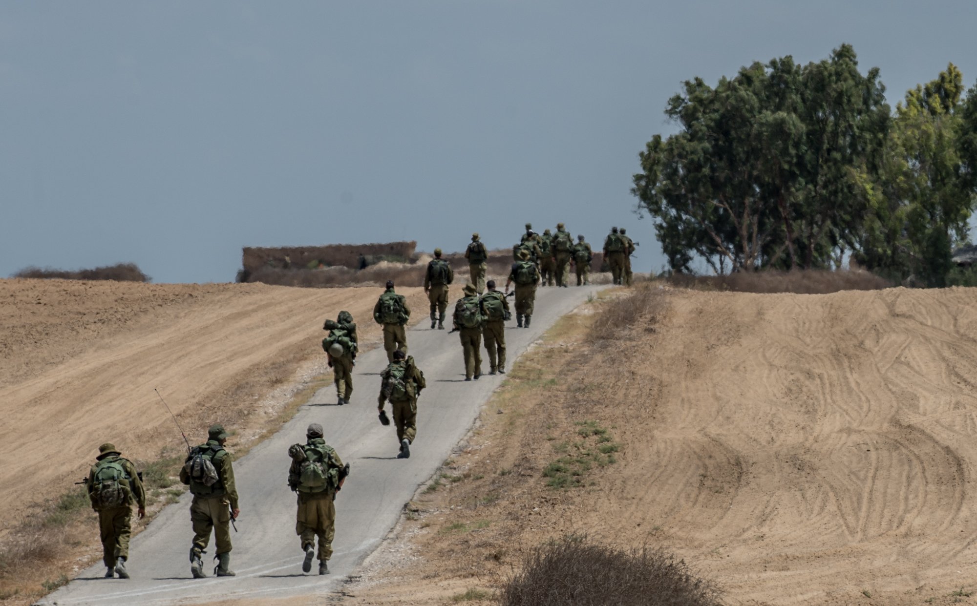 Israeli soldiers march in southern Israel near the border with Gaza, on July 18, 2014, the 11th day of Operation Protective Edge.