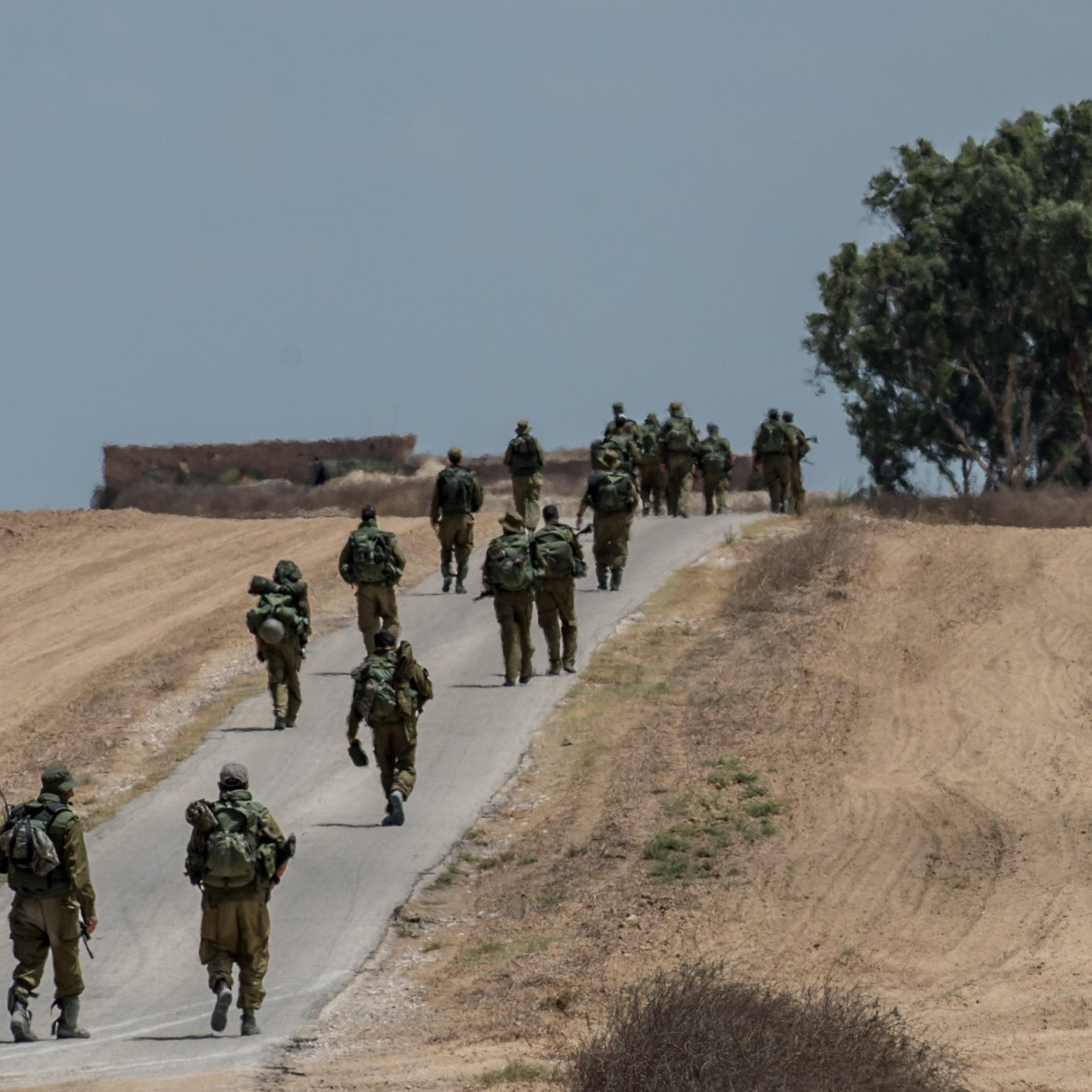 Israeli soldiers march in southern Israel near the border with Gaza, on July 18, 2014, the 11th day of Operation Protective Edge.