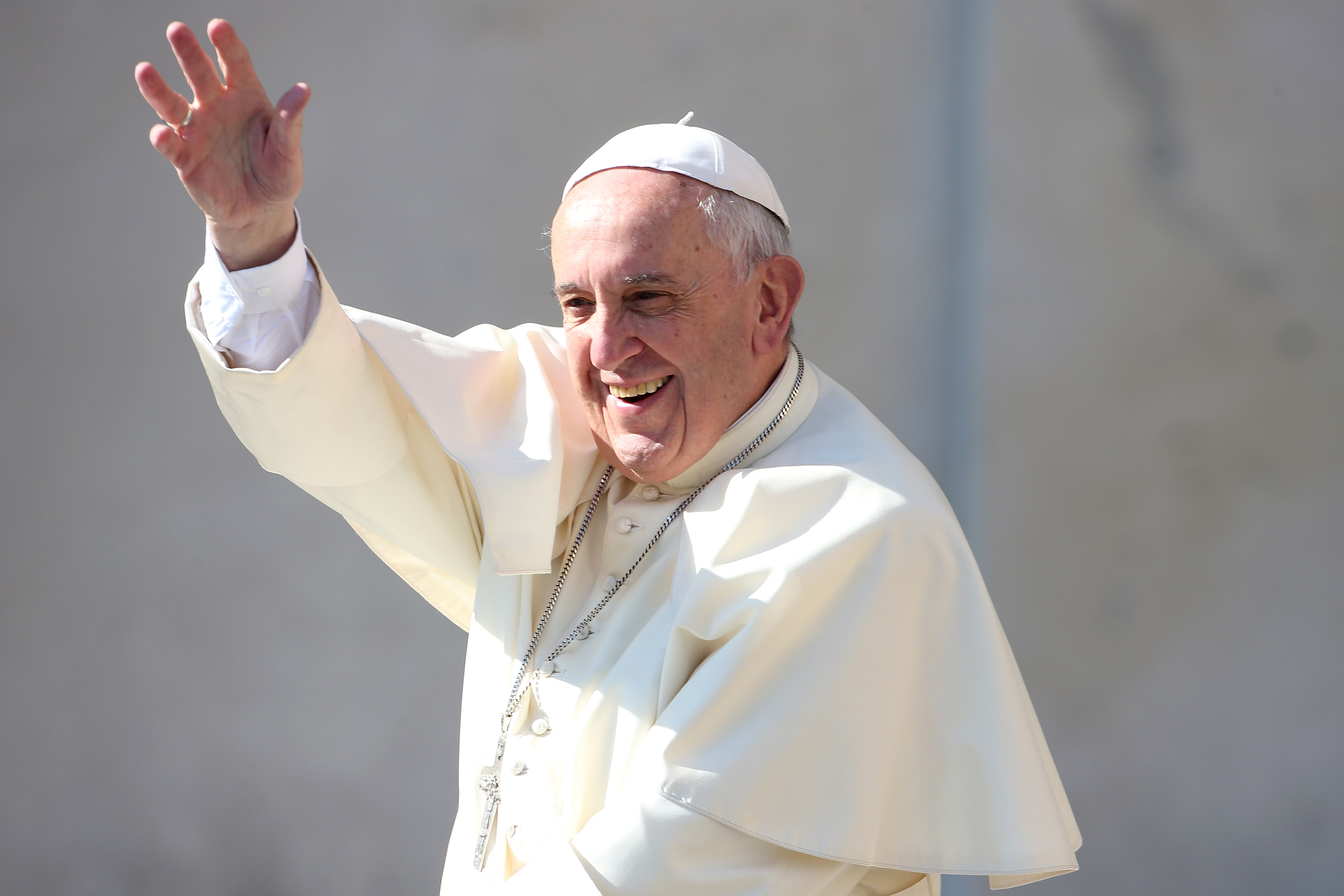 Pope Francis waves to the faithful as he arrives in St. Peter's Square for his weekly audience in Vatican City on May 4, 2016.
