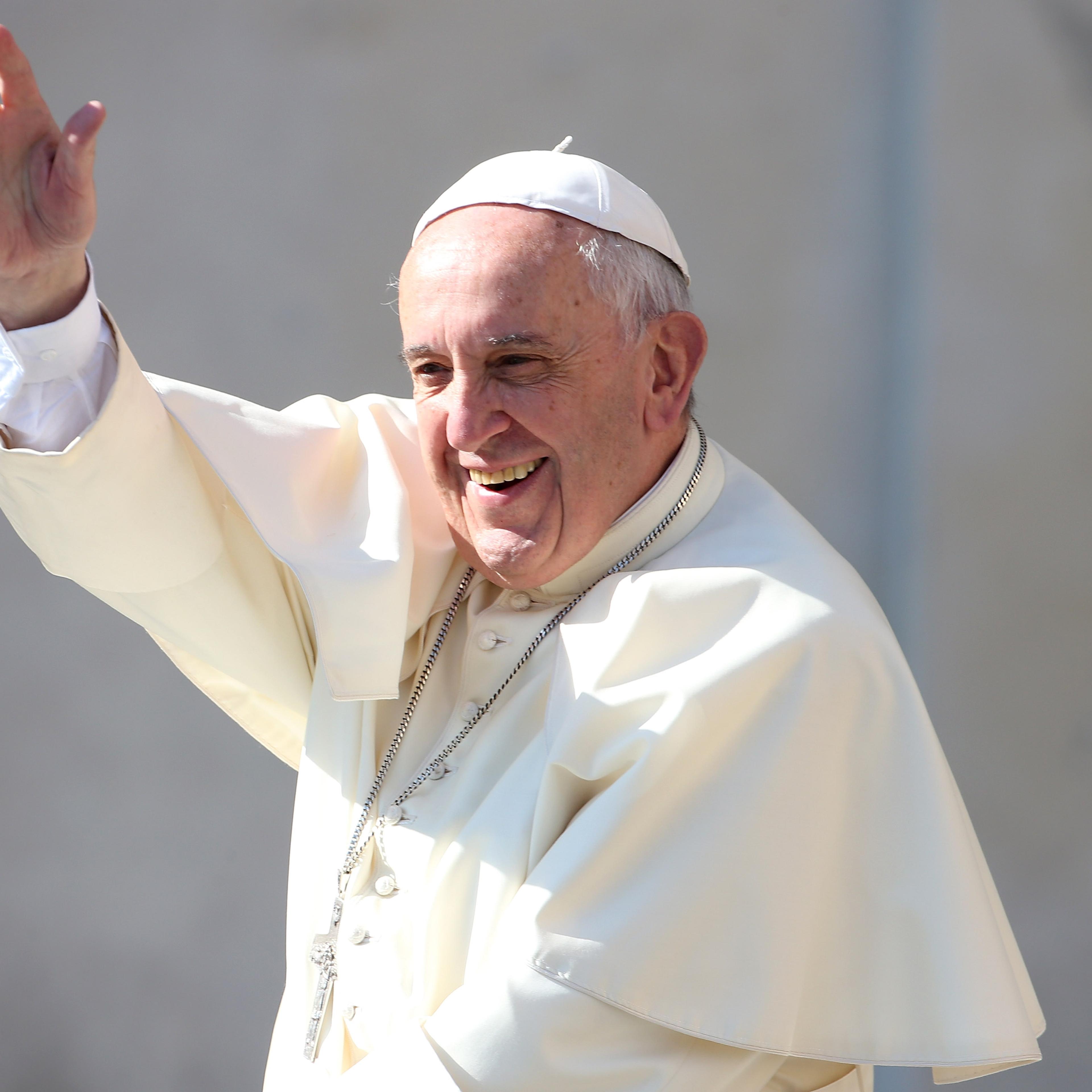 Pope Francis waves to the faithful as he arrives in St. Peter's Square for his weekly audience in Vatican City on May 4, 2016.
