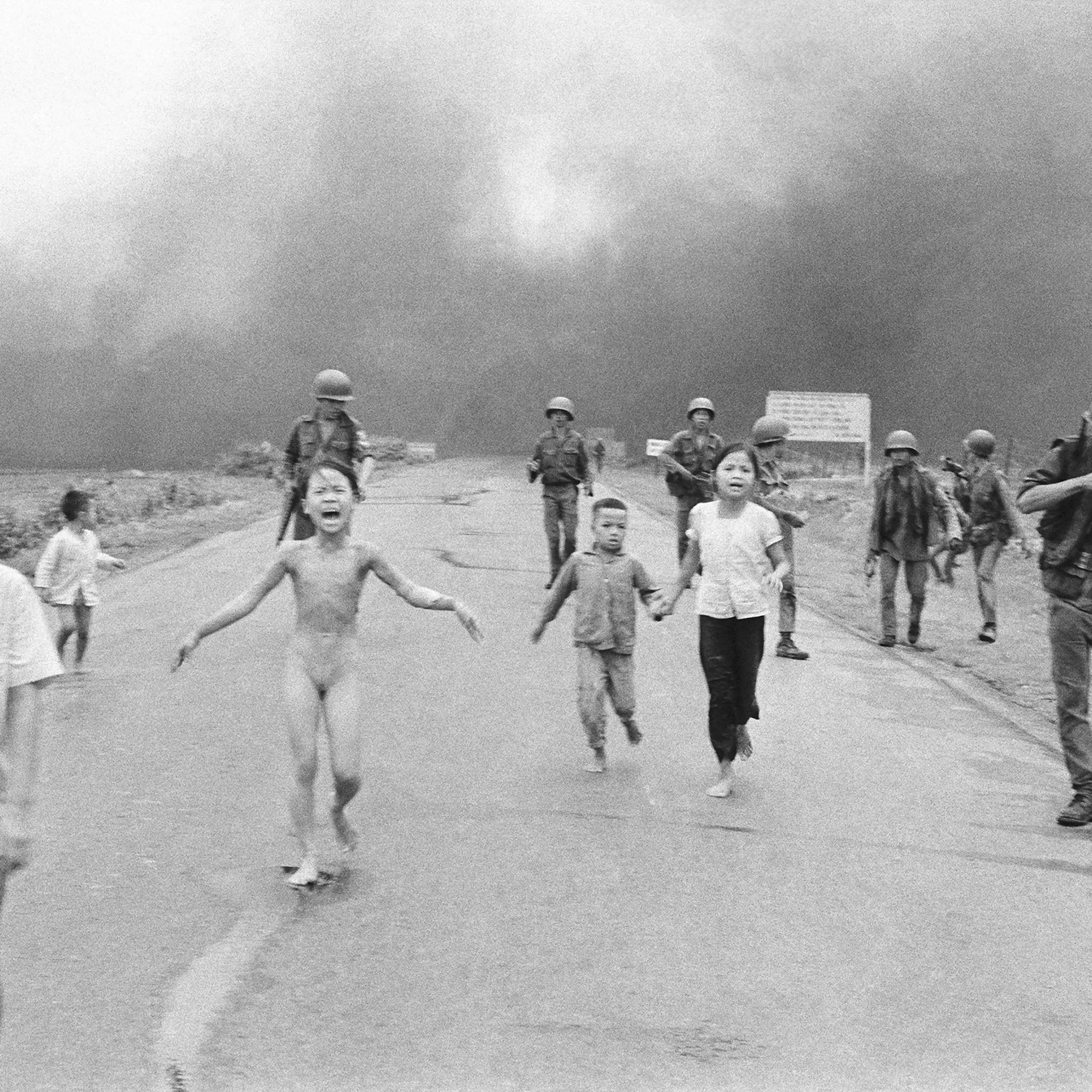 Nick Ut's photograph of South Vietnamese forces follow after terrified children, including 9-year-old Kim Phuc, center, as they run down Route 1 near Trang Bang after an aerial napalm attack on suspected Viet Cong hiding places, June 8, 1972.