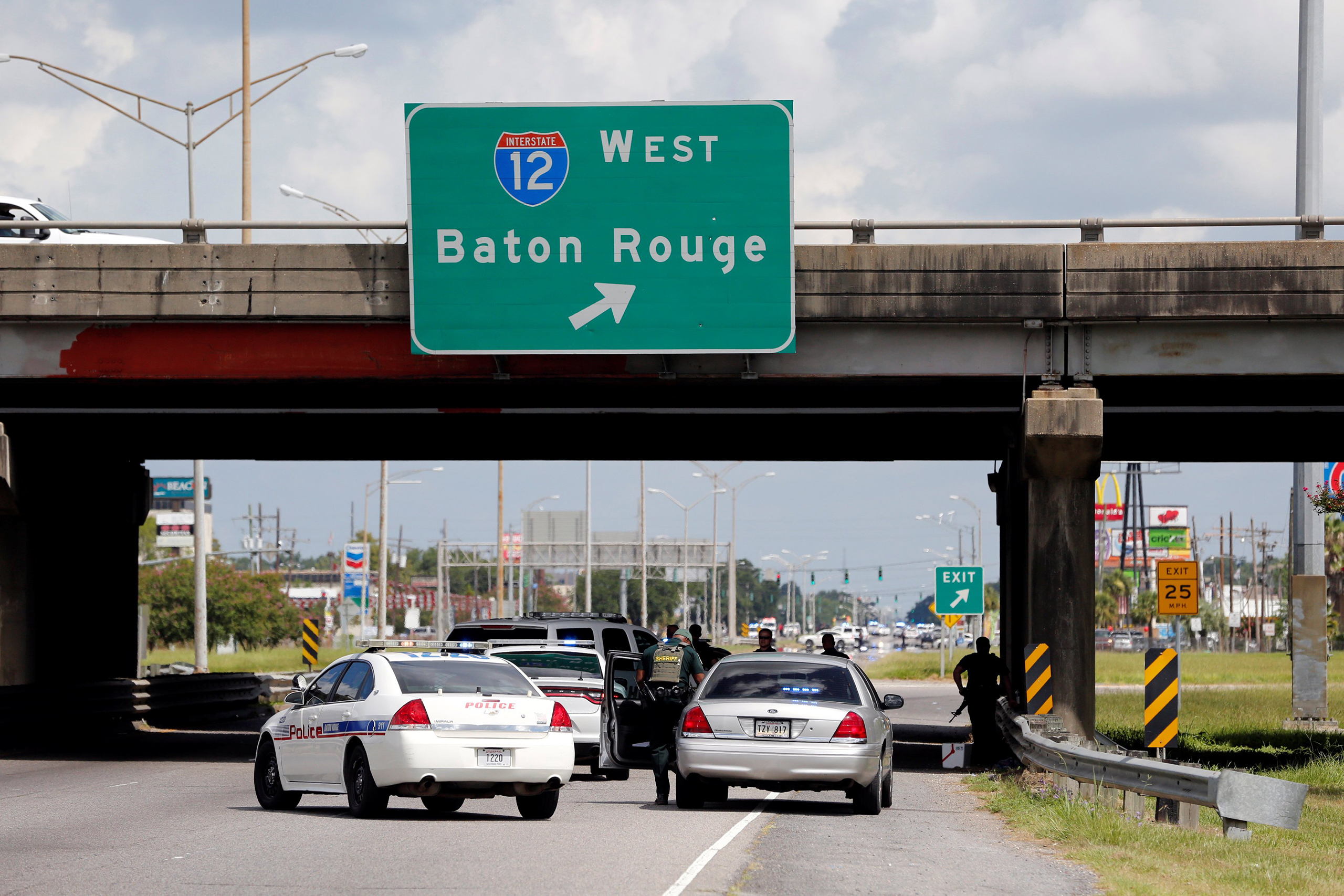 Police officers block off a road after a shooting of police in Baton Rouge, Louisiana, July 17, 2016.